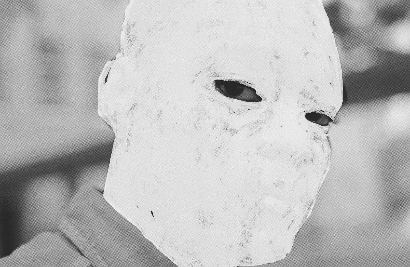A boy's face is erased by white chalk. Illustrations by Raquel Hazell, 2025, based on stills from Nickel Boys (2024), dir. RaMell Ross, courtesy Orion Pictures.