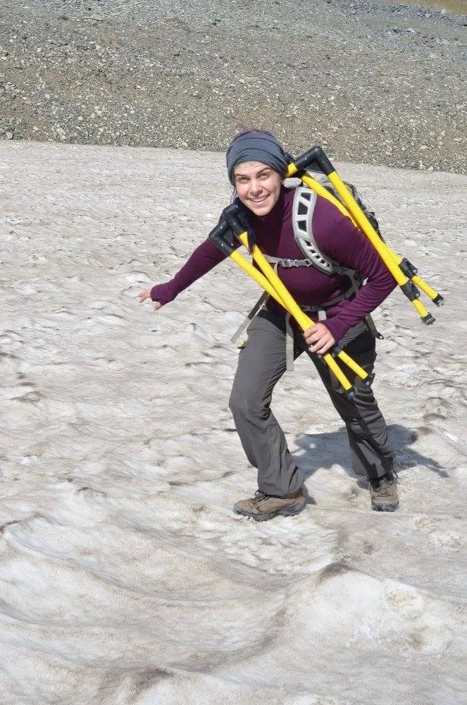 Cassie Stuurman, MSc. Geophysics Student at UT Austin, carries GPR equipment up Sourdough Rock Glacier, AK