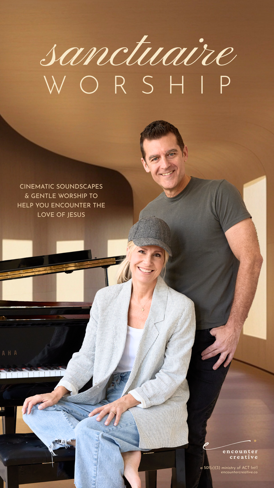 A smiling woman in a light striped blazer and jeans, sitting at a black grand piano, with a man in a grey t-shirt standing behind her, in a modern room with wooden curved ceiling and windows. The image promotes Sanctuary Worship, a ministry by Encounter Creative.