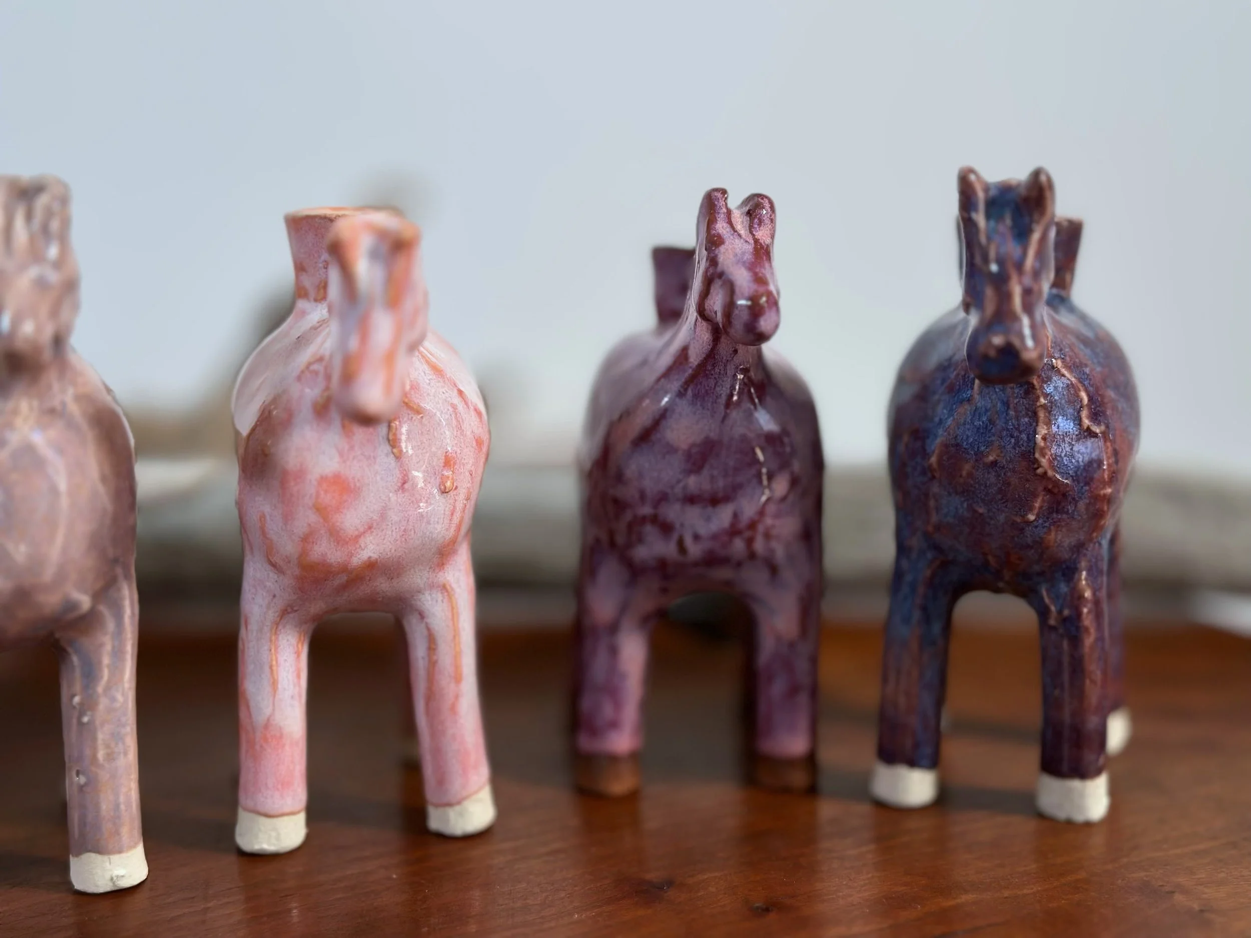 salmon pink, raspberry pink, lupine purple (small horses) yellowstoneware by Jesse fales..jpg
