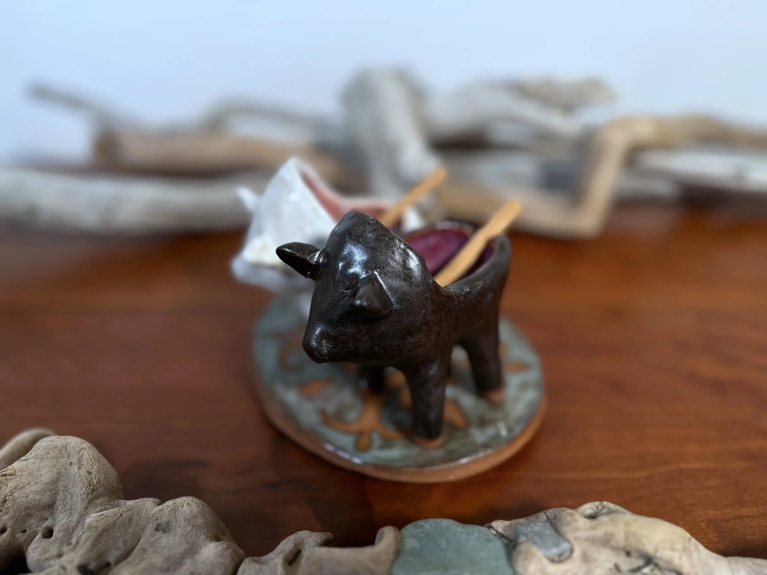 side view pepper Pig Salt and Pepper ceramic set by yellowstoneware by jesse fales.jpg