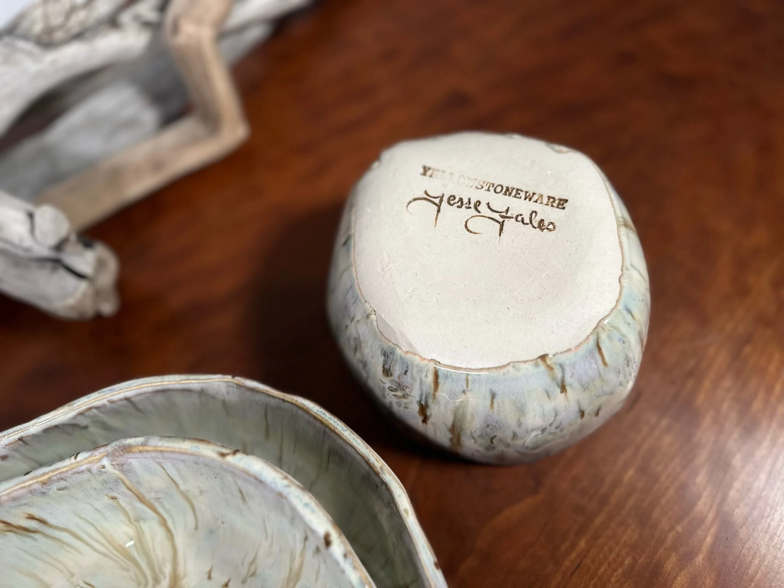 set 1 of 3 nesting bowls unique glazes by yellowstone war by jesse fales signed at the bottom.jpg