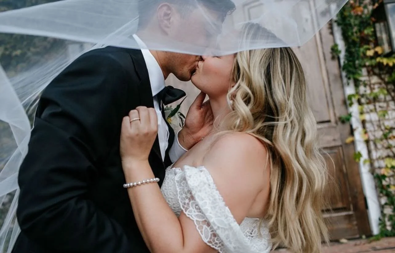 A kiss sealed with forever under the veil!

Vendor Spotlight:
Photography: @brooke.couch 
Bridal Beauty: @brushworx
Planning: @inaninstantevents
Venue: @thefoxglovemarietta

🩵: Brushworx: Hair &amp; Makeup
👰&zwj;♀️: Weddings | Engagements | Events 