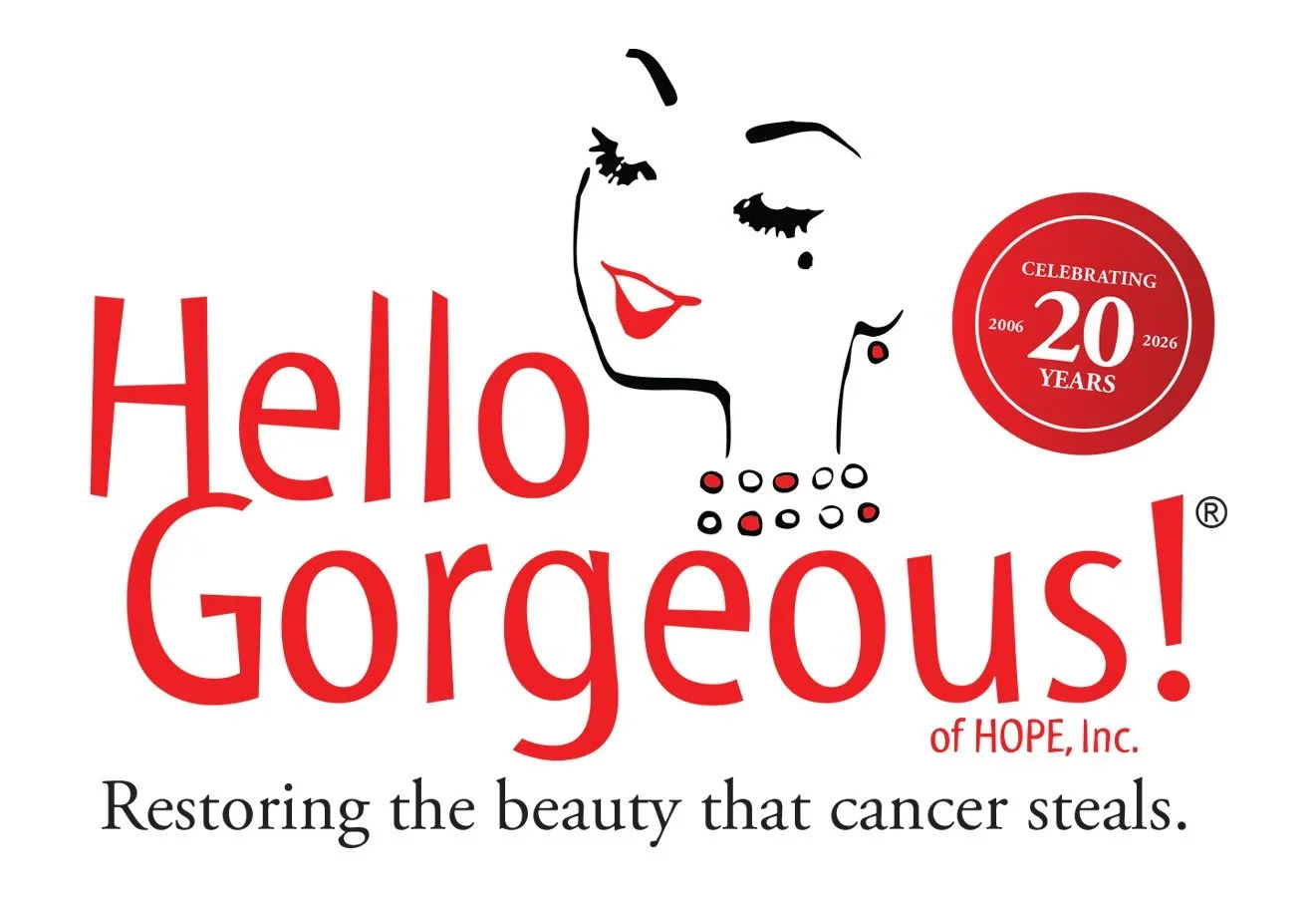 A graphic with the text 'Hello Gorgeous!' in red, along with a stylized outline of a woman's face, an earring, and a necklace. There is a red circle celebrating 20 years from 2006 to 2026. The bottom text reads 'Restoring the beauty that cancer steals.'