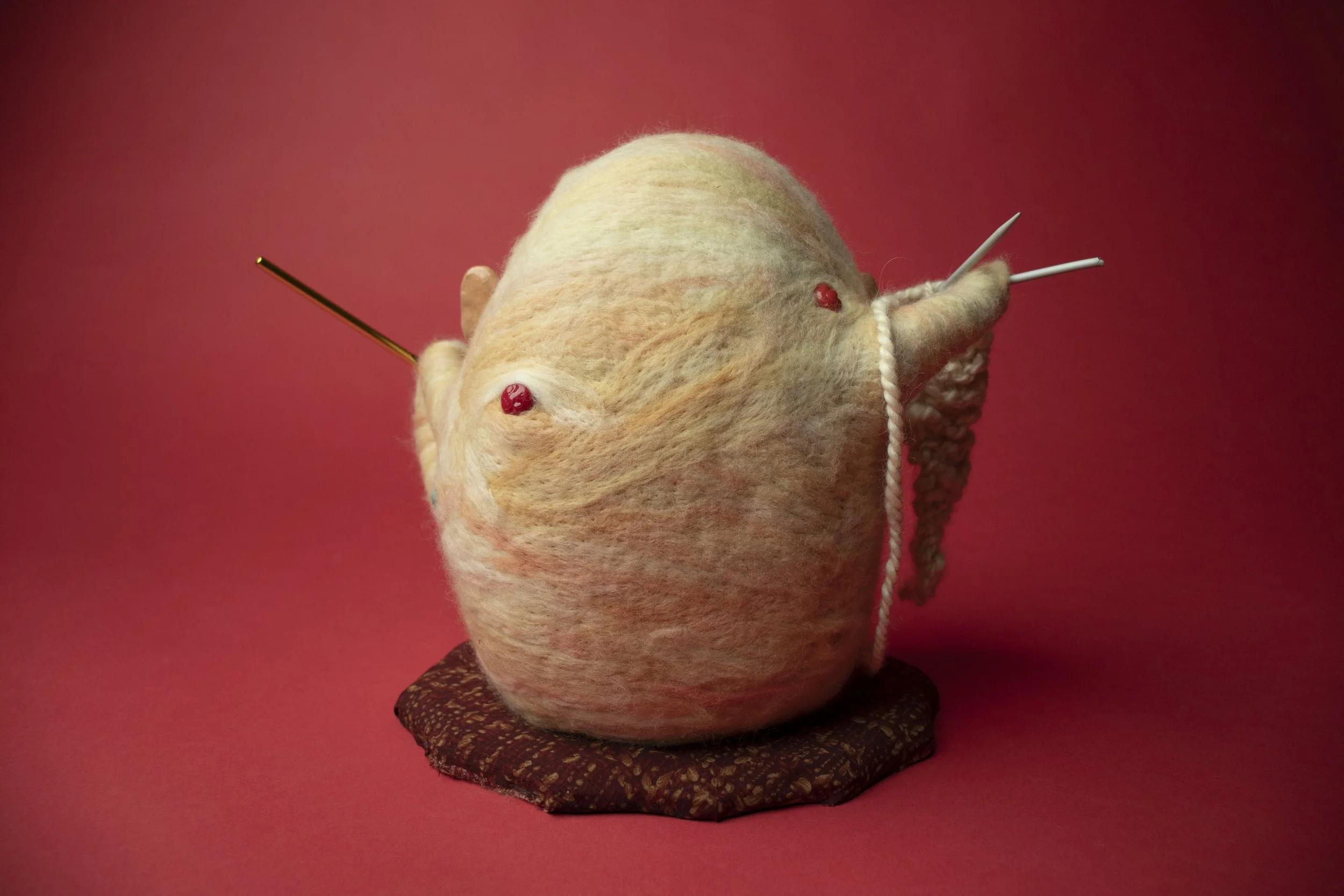 Growing Natural Pivot.

Polymer clay, dyed merino wool, handspun yarn, knitting needles, crochet hook, on wood 
25 x 23 x 17 cm 
2023