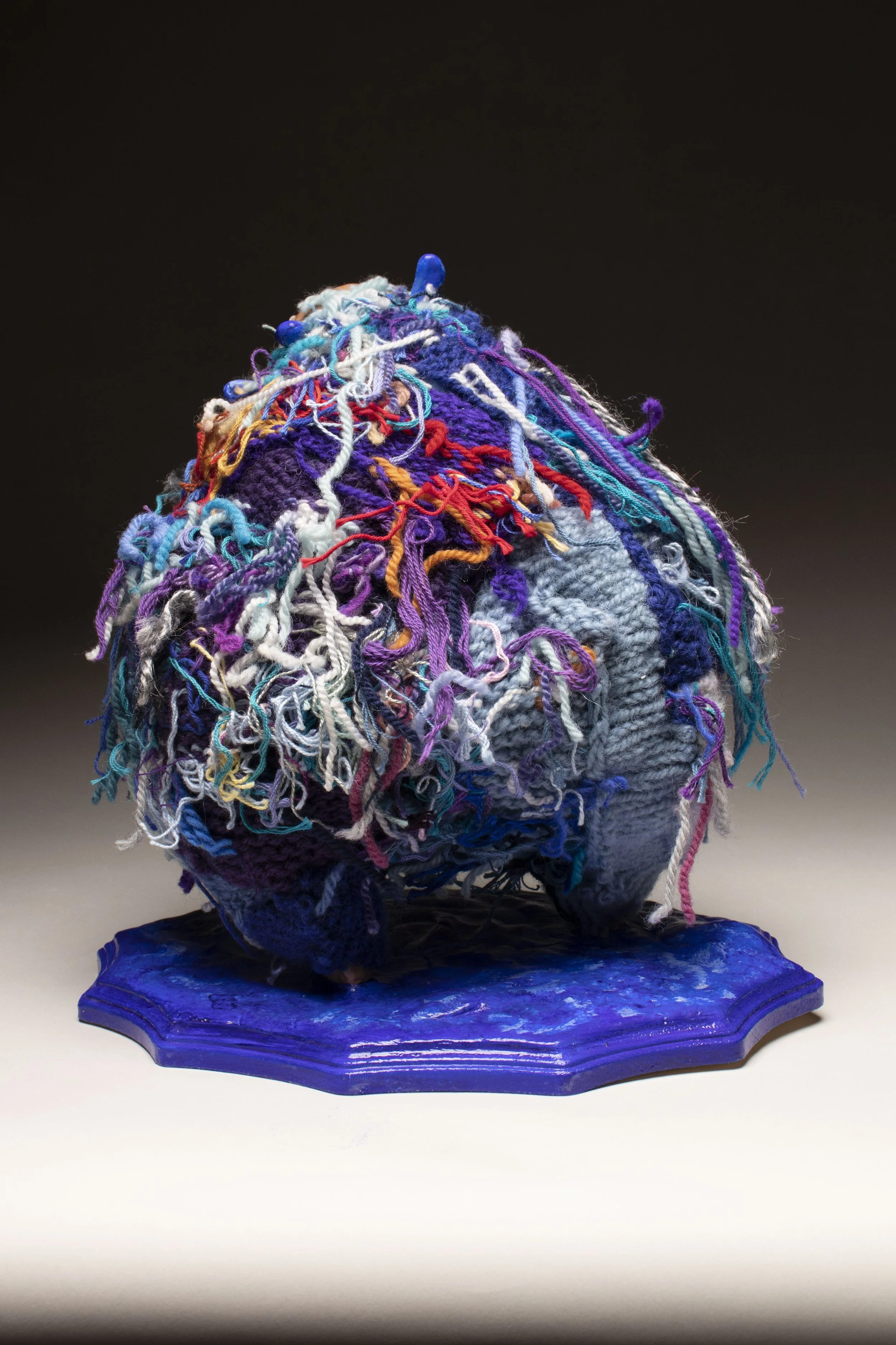 Sad Blue.

Polymer clay, wire, yarn, on wood 
31 x 28 x 18 cm
2023