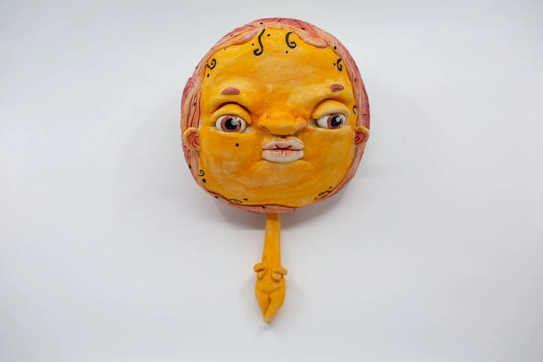 Orange Floating Head
Porcelain and amaco underglazes
Mid-range Cone 6 (1220°C) 
Slab built 
24 x 15 x 6 cm 
2026 