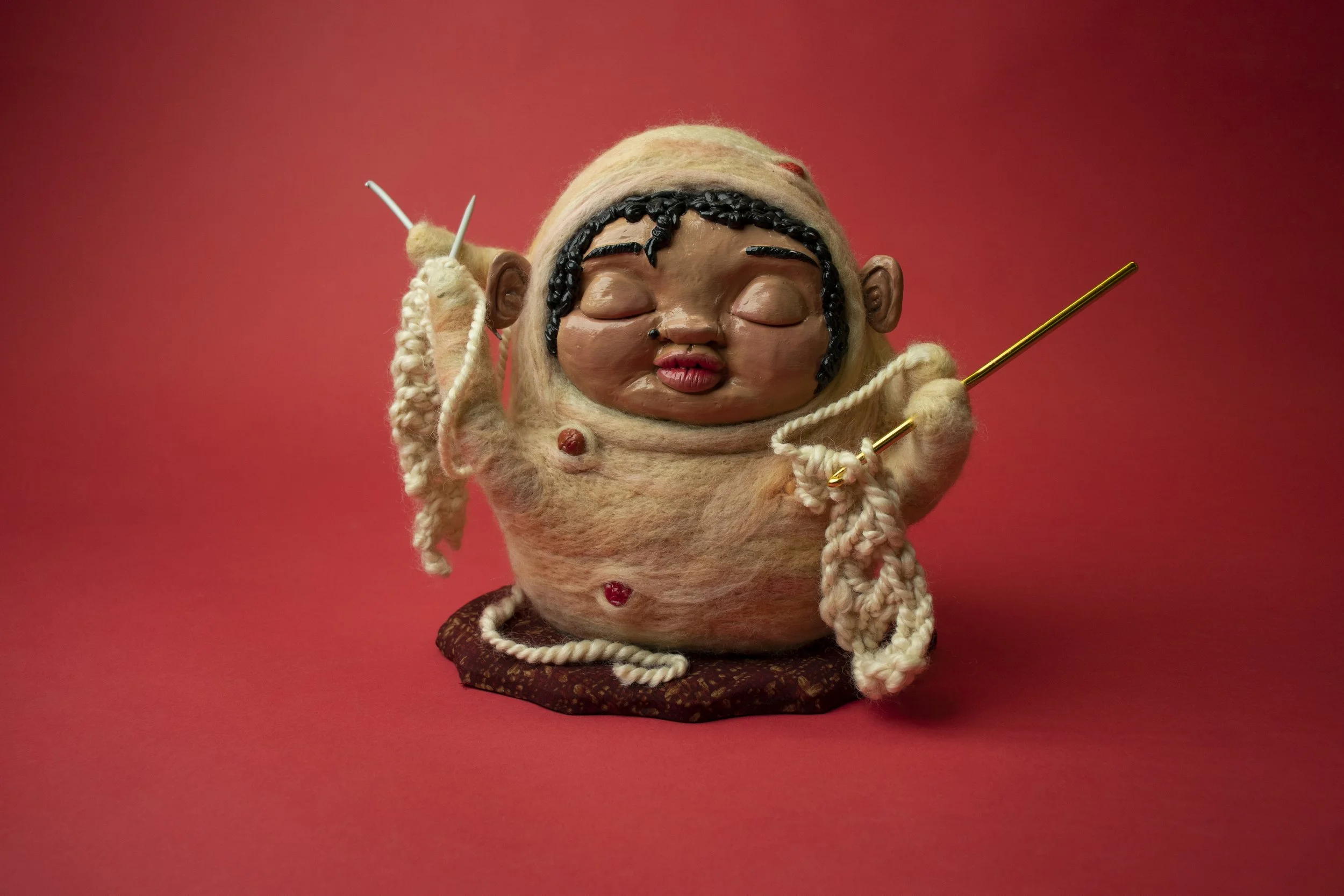 Growing Natural Pivot.

Polymer clay, dyed merino wool, handspun yarn, knitting needles, crochet hook, on wood 
25 x 23 x 17 cm 
2023