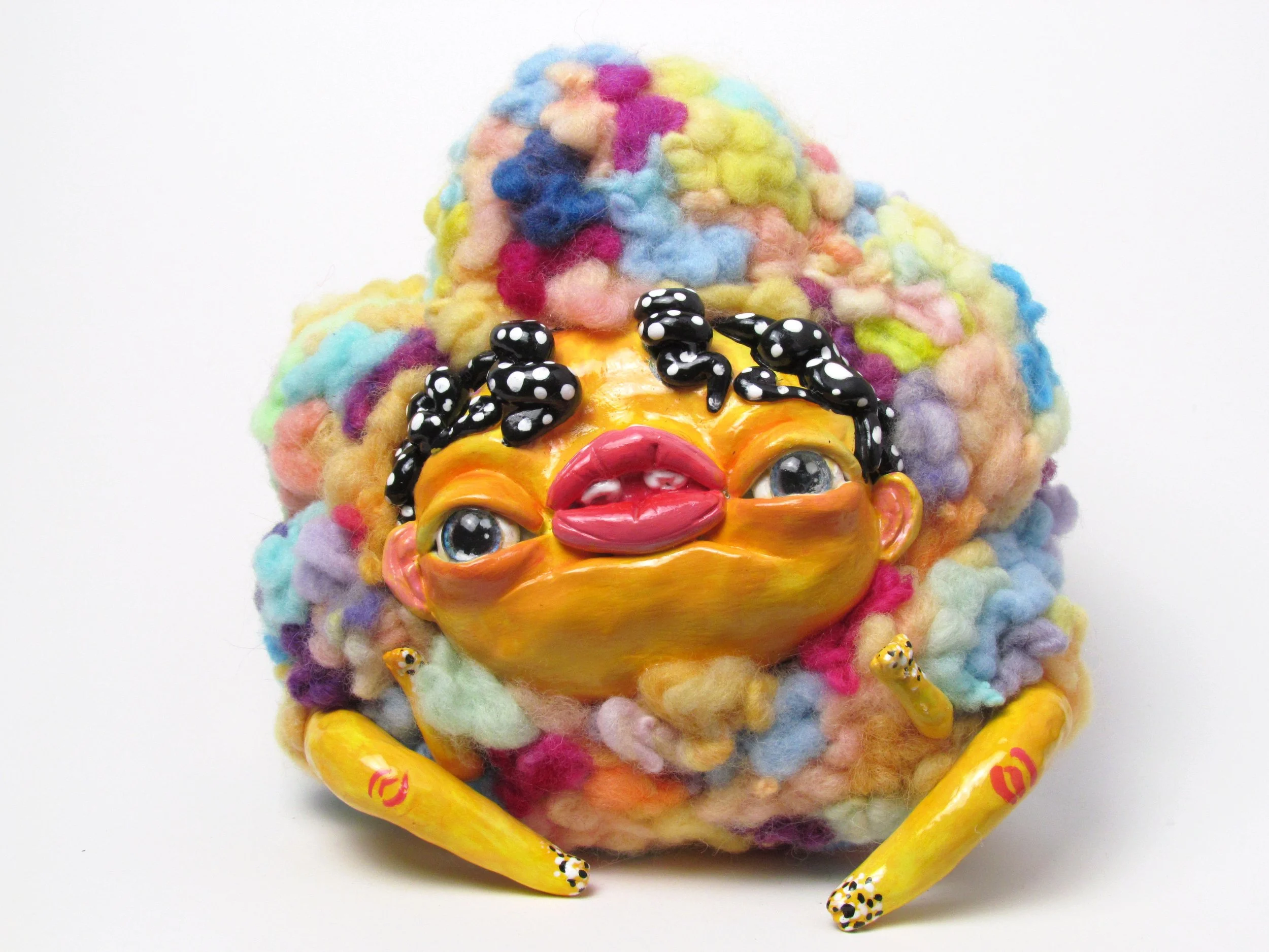 
Yellow creature with spots.

Polymer clay, dyed wool, wire, beads, acrylic paint 
18 x 19 x 11 cm
2024
