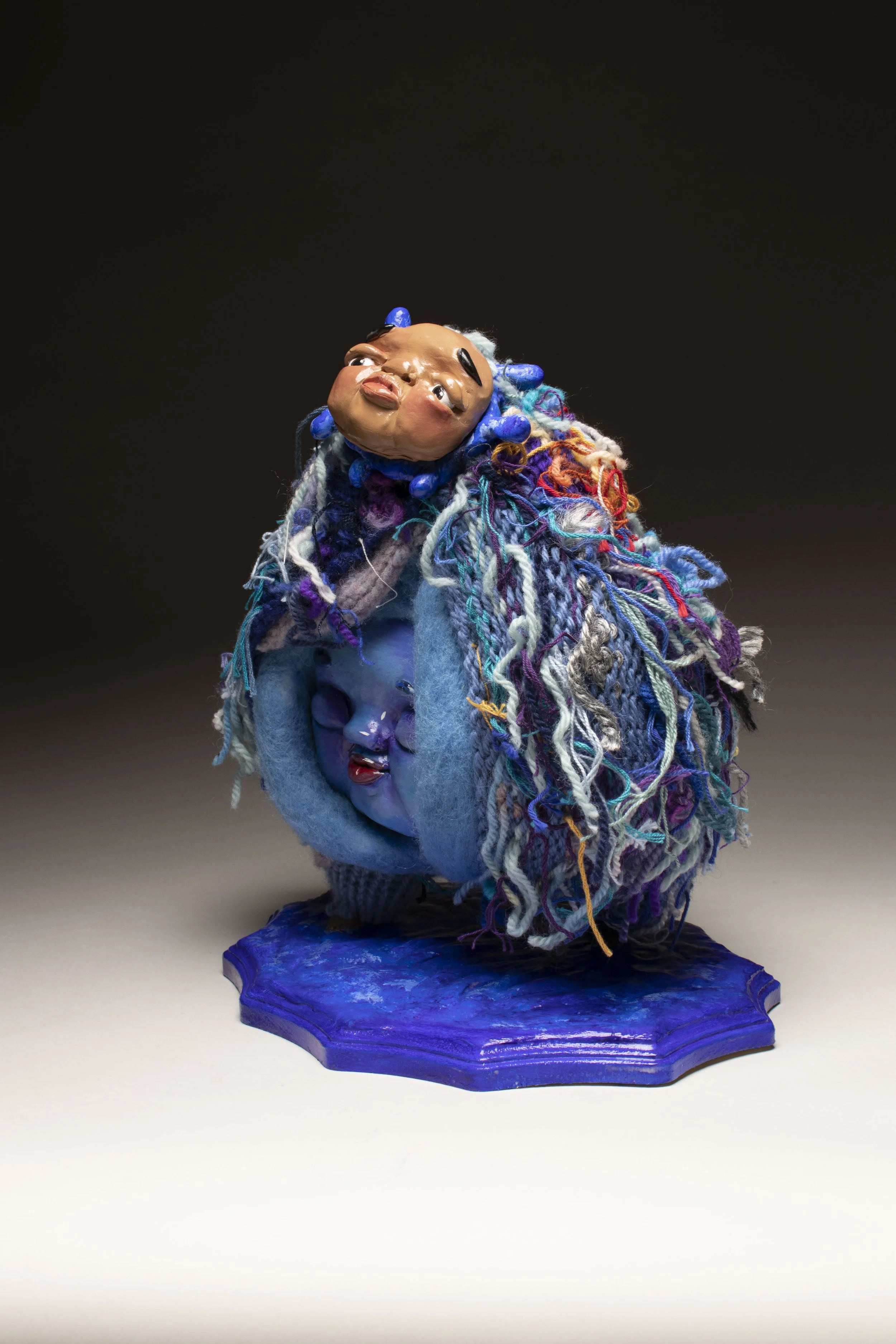 Sad Blue.

Polymer clay, wire, yarn, on wood 
31 x 28 x 18 cm
2023