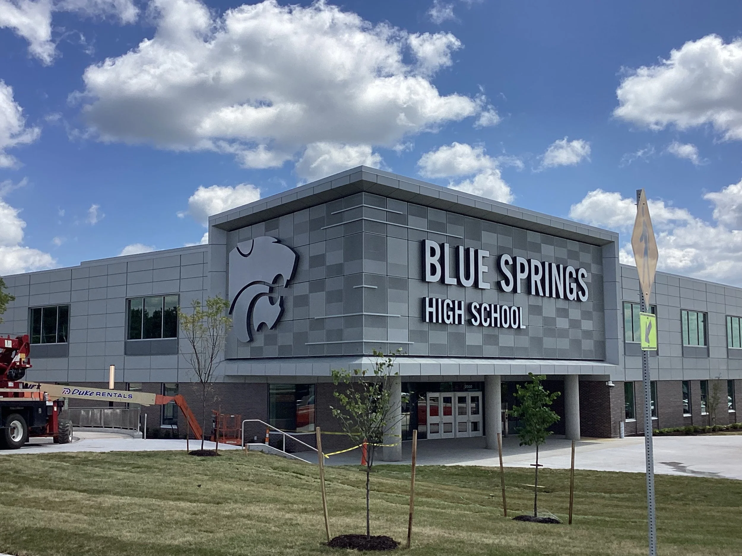 Blue Springs High School building exterior with cloudy sky