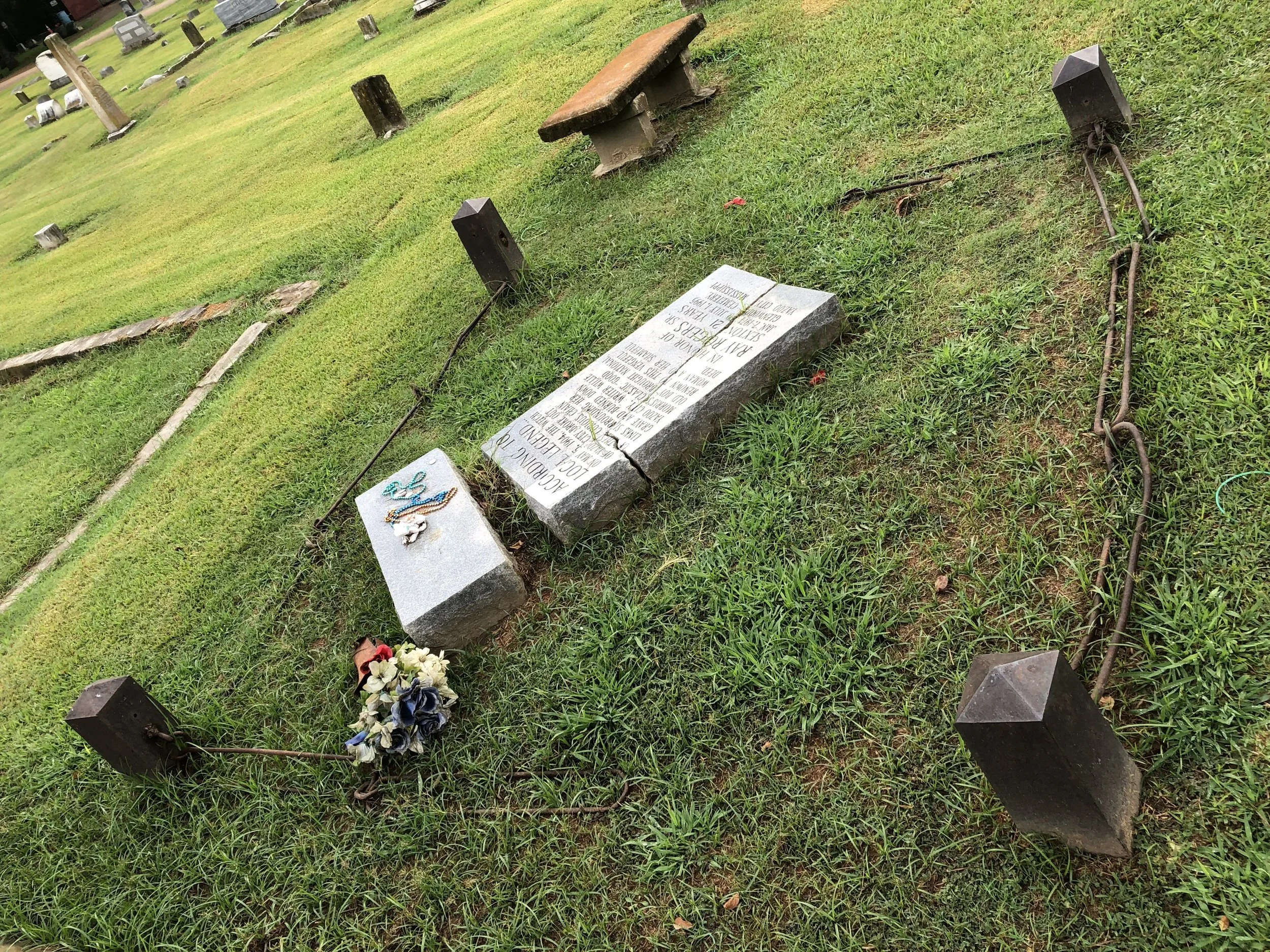 Another view of the gravestone and surrounding "barriers".