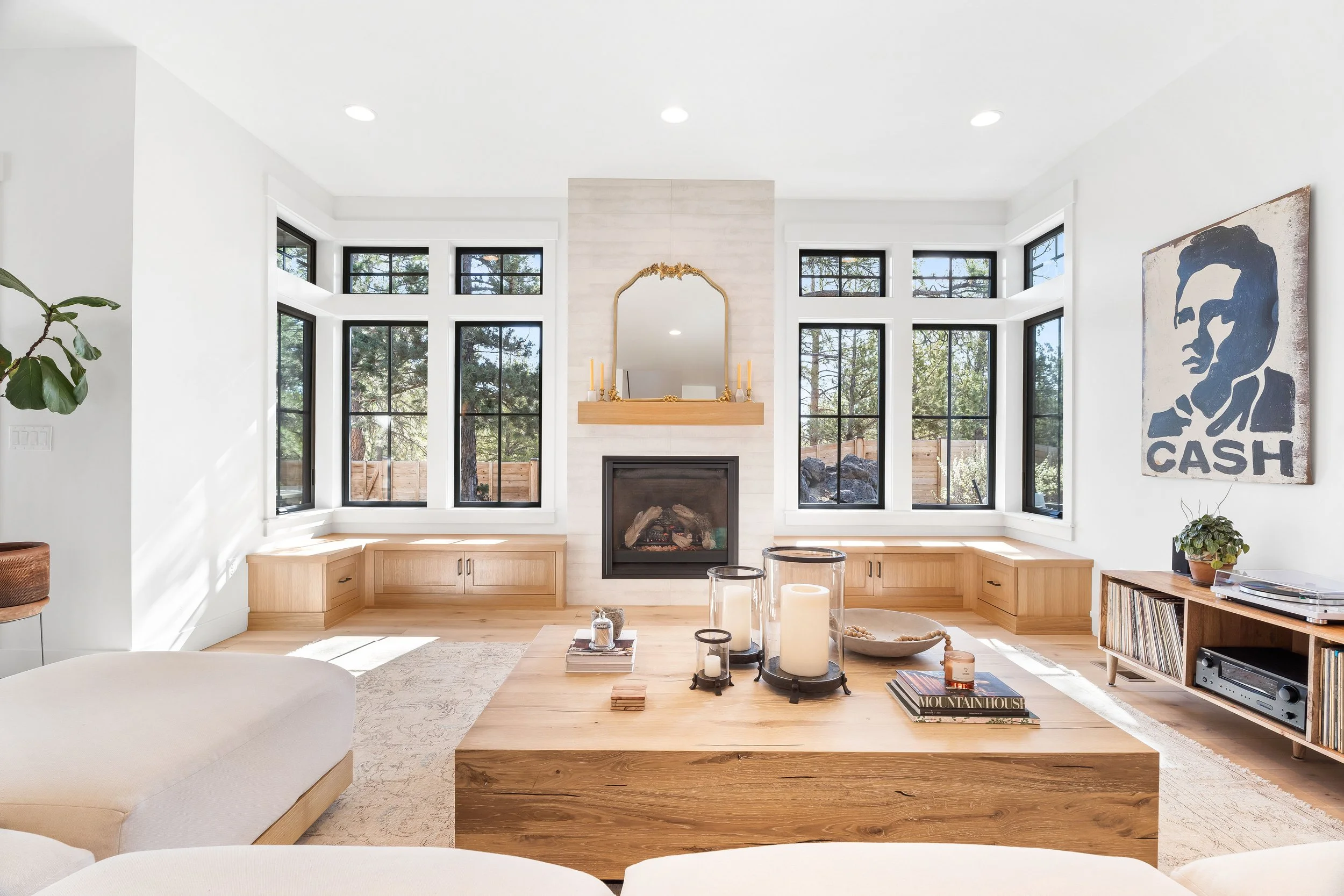 Sunlit living area with layered, natural furnishings