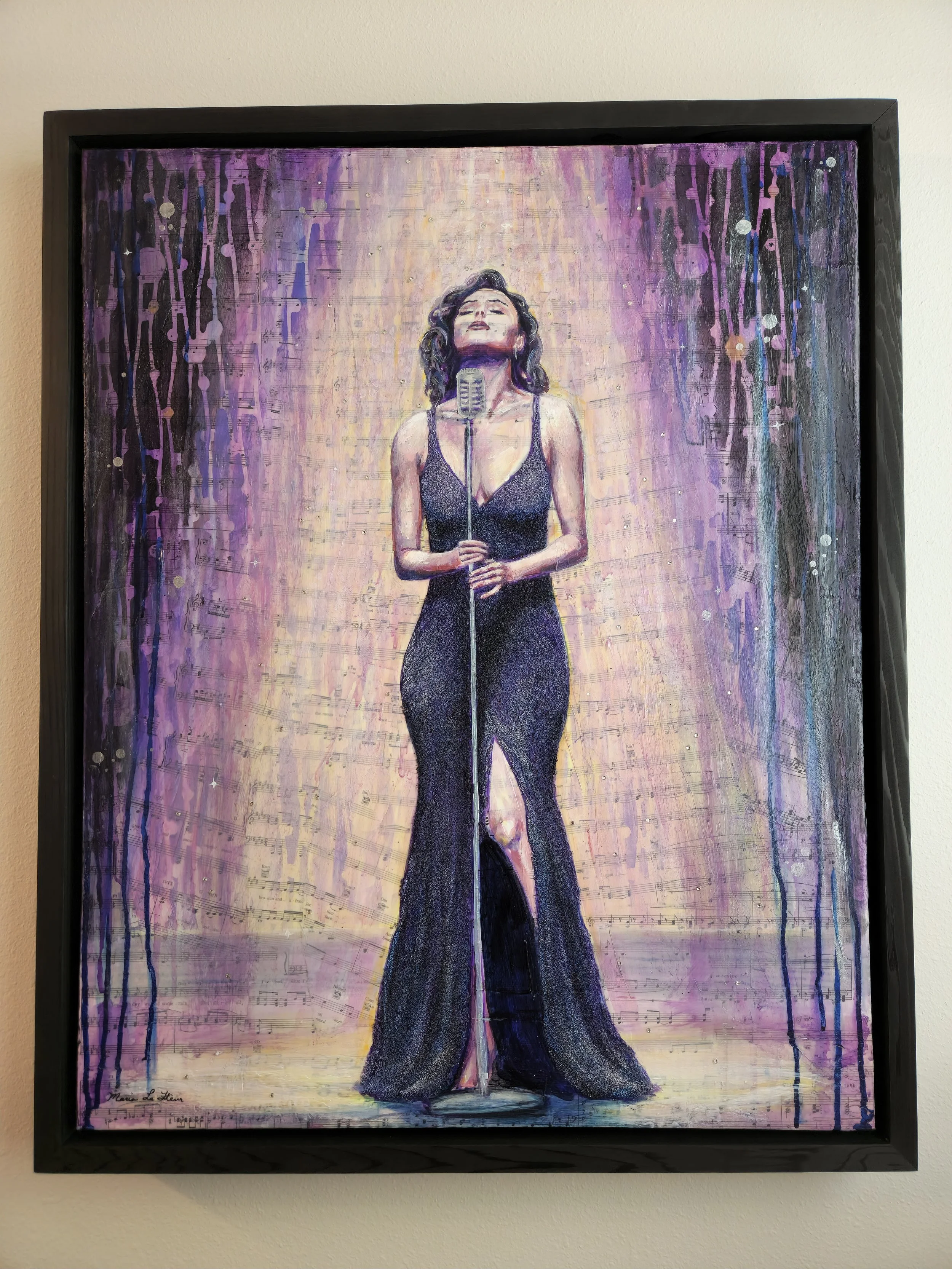 Mixed media on sheets of music. Woman wearing a beaded, long gown singing on stage under spotlight. Painted in purples, yellows, and blues. Rhinestones and glitter highlights. Framed and ready to hang. 24 x 30.