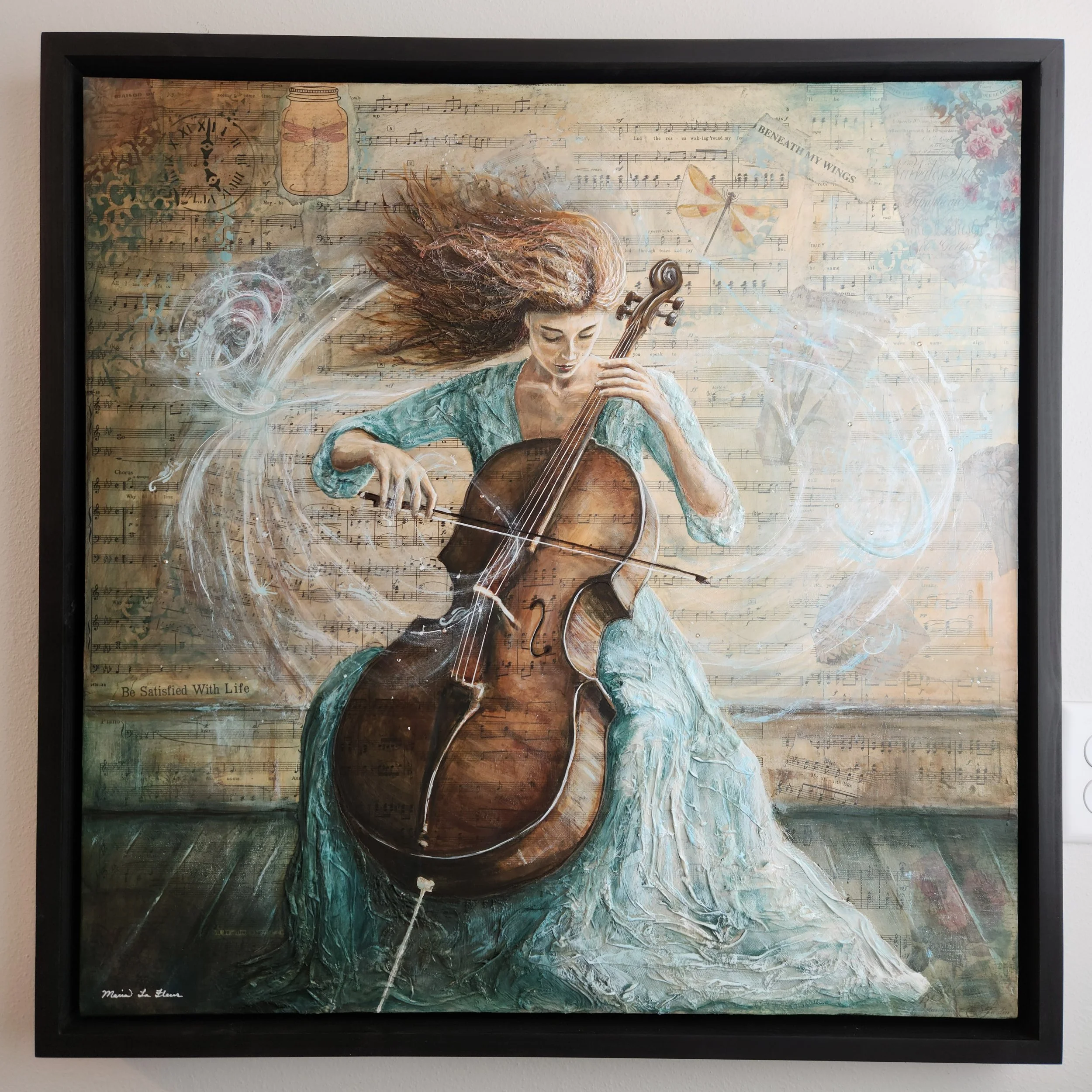 Woman in light teal dress playing cello with visible sounds flowing around her. Mixed media on canvas, framed ready to hang.