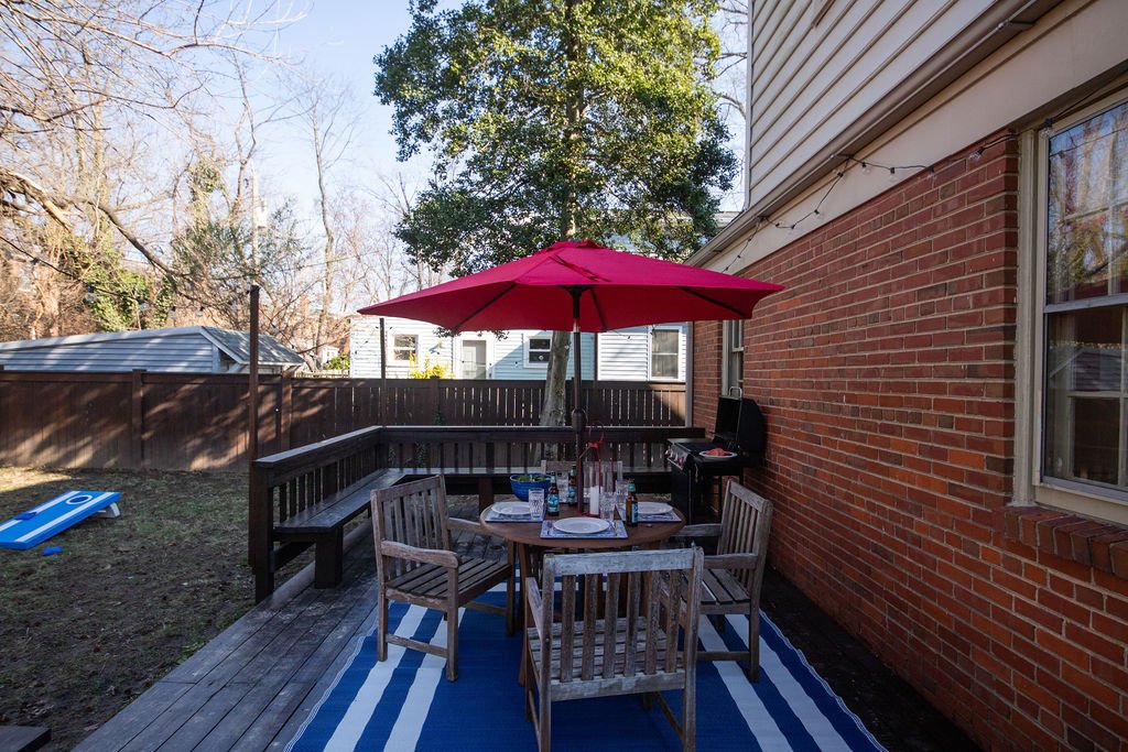 Large deck/patio with grill, fire pit and corn-hole