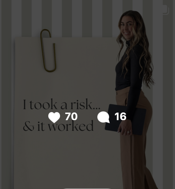 A woman standing next to a board with the text "I took a risk... & it worked." She is holding a folder and smiling at the camera.