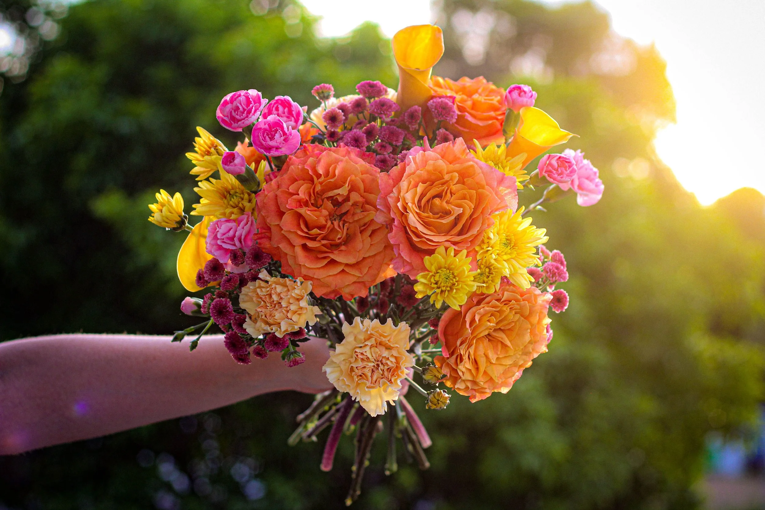 Colourful wedding bouquet by Brisbane florist From June featuring roses, dahlias and seasonal blooms.