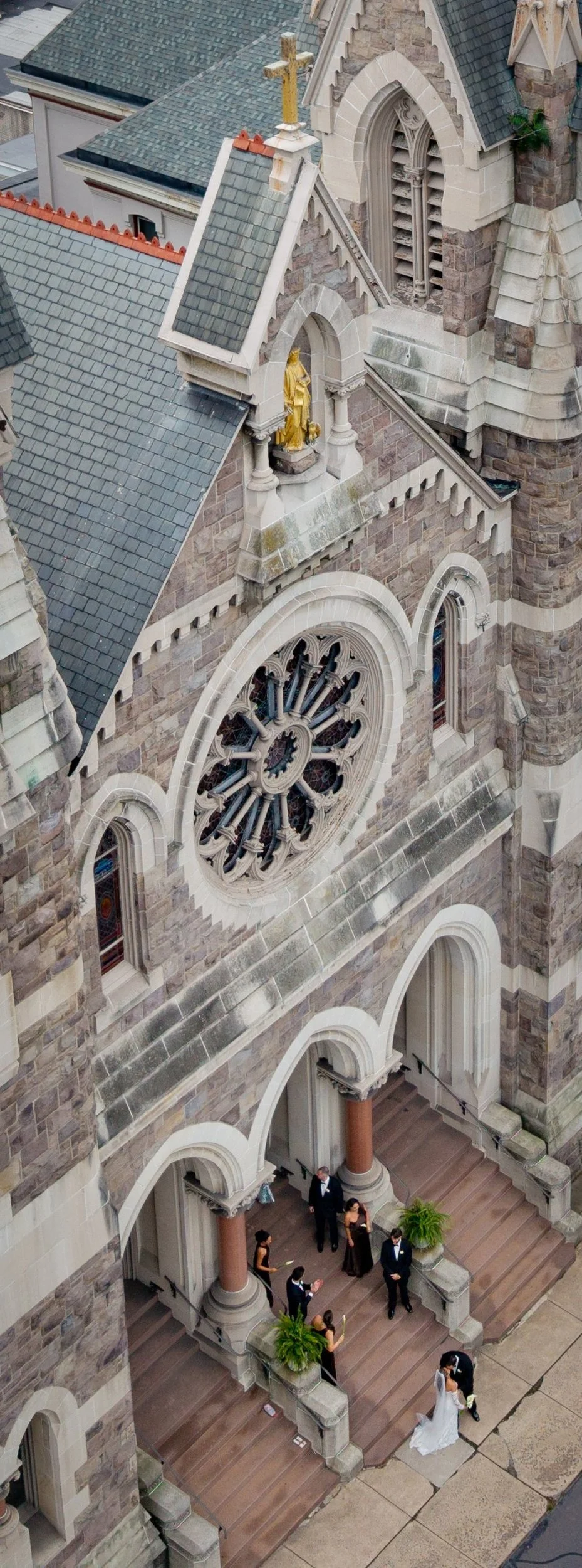 Weddings - Ceremony 1 - cathedral statue and couple from above.jpg