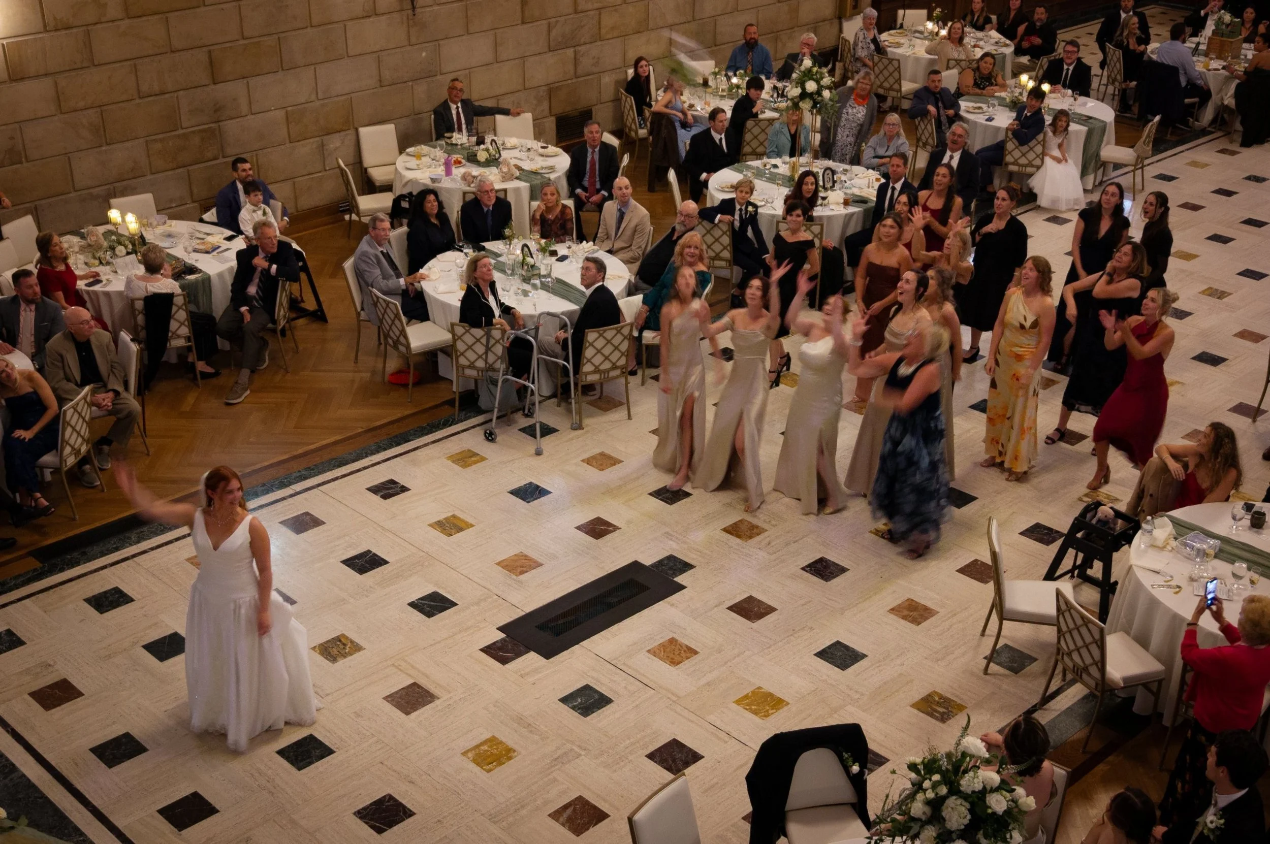 Weddings - Reception 4 - bouquet toss overhead.jpg