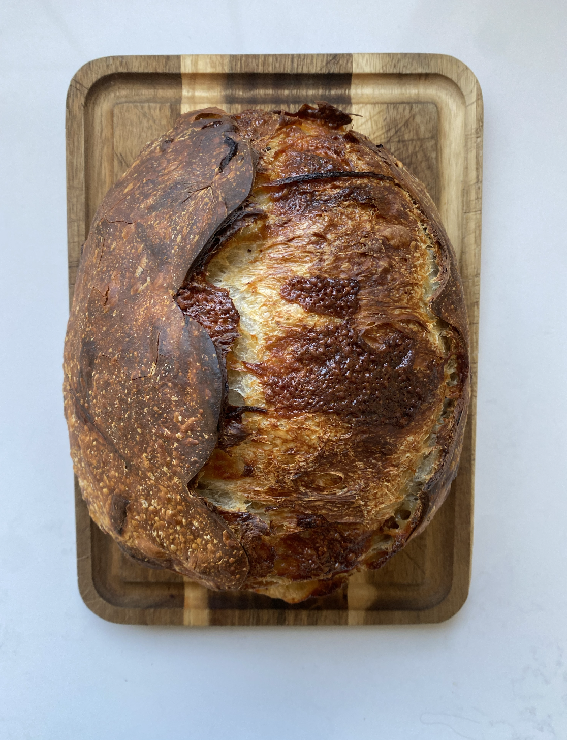 Caramelized Onion and Gruyere Sourdough Baked Loaf on Board Rebecca Witt Sourdough Mama.png