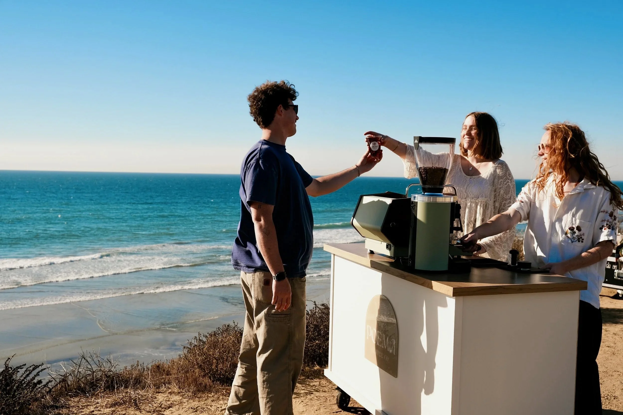 Poema Coffee Co. mobile coffee cart serving guests at an oceanside private event in San Diego, Southern California