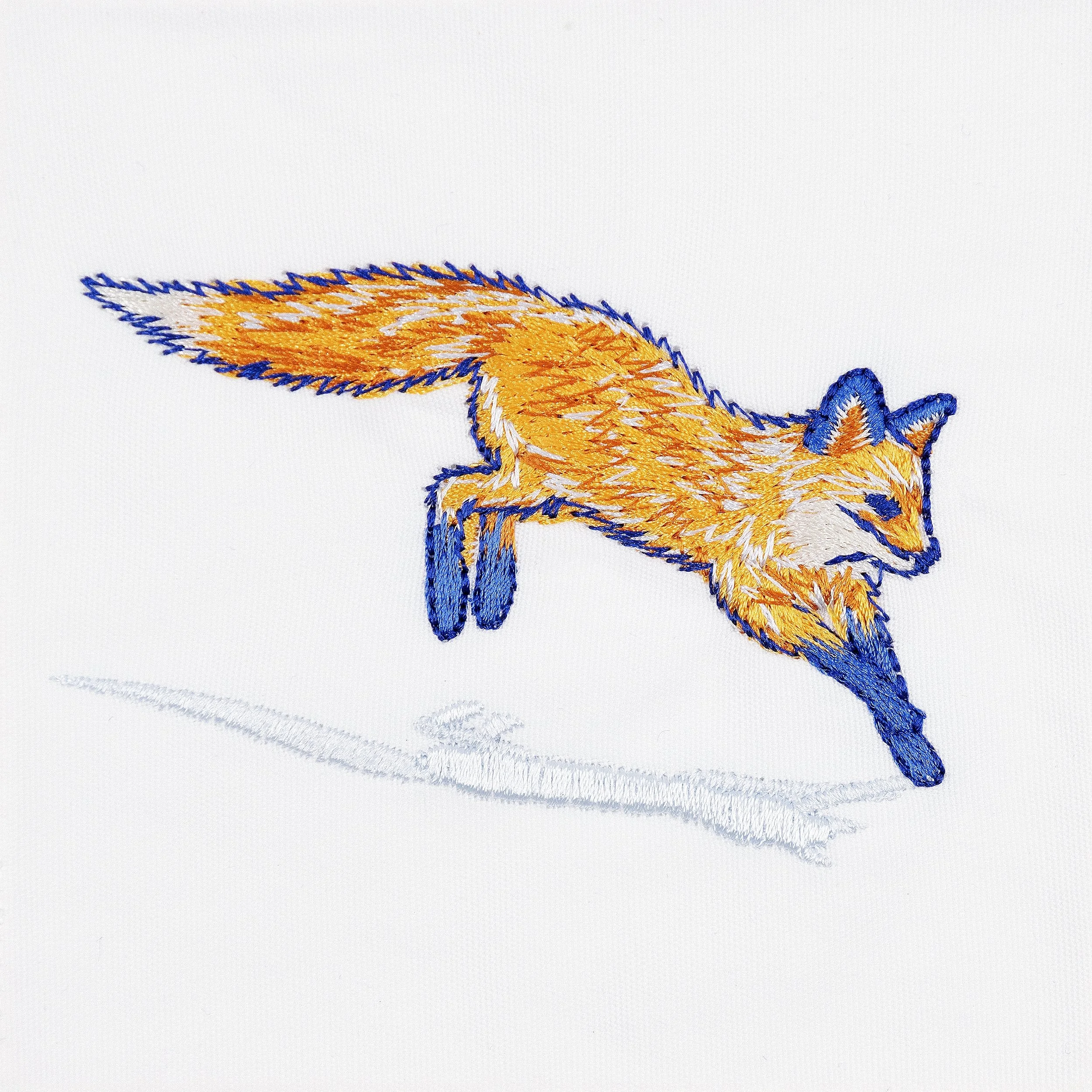 Close-up of leaping fox embroidery detail on fox cocktail napkin
