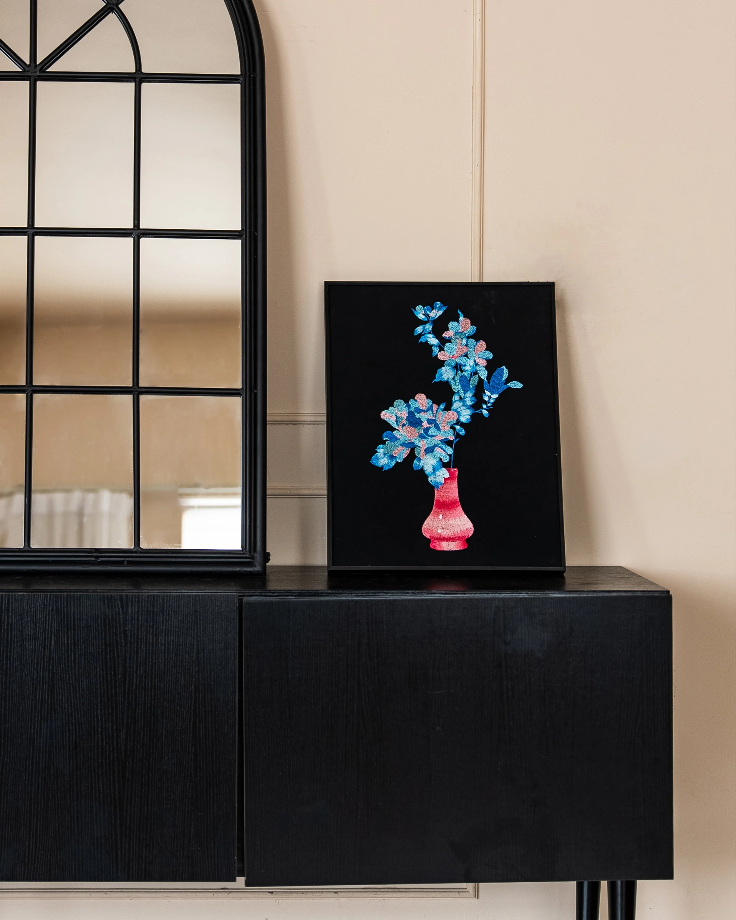 Etherelle Art on a black side cabinet.jpg