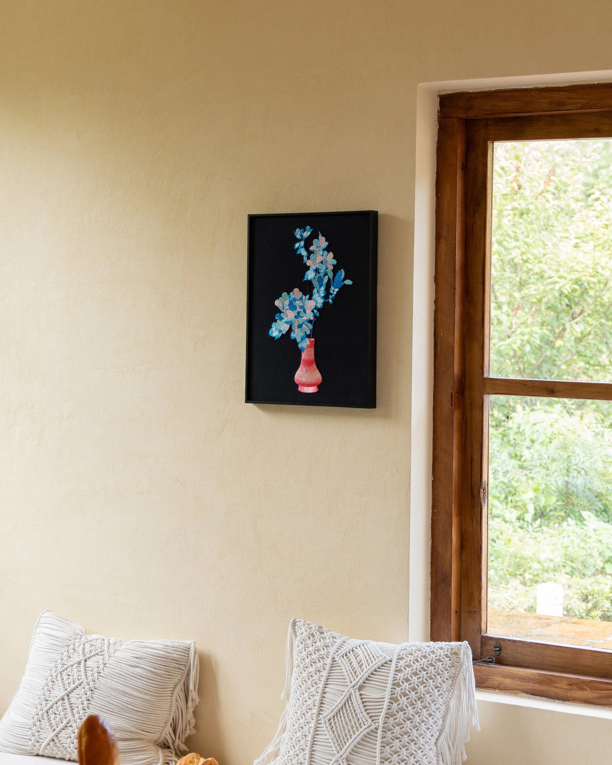 Etherelle Embroidery Art Hanging on the wall by a window.jpg