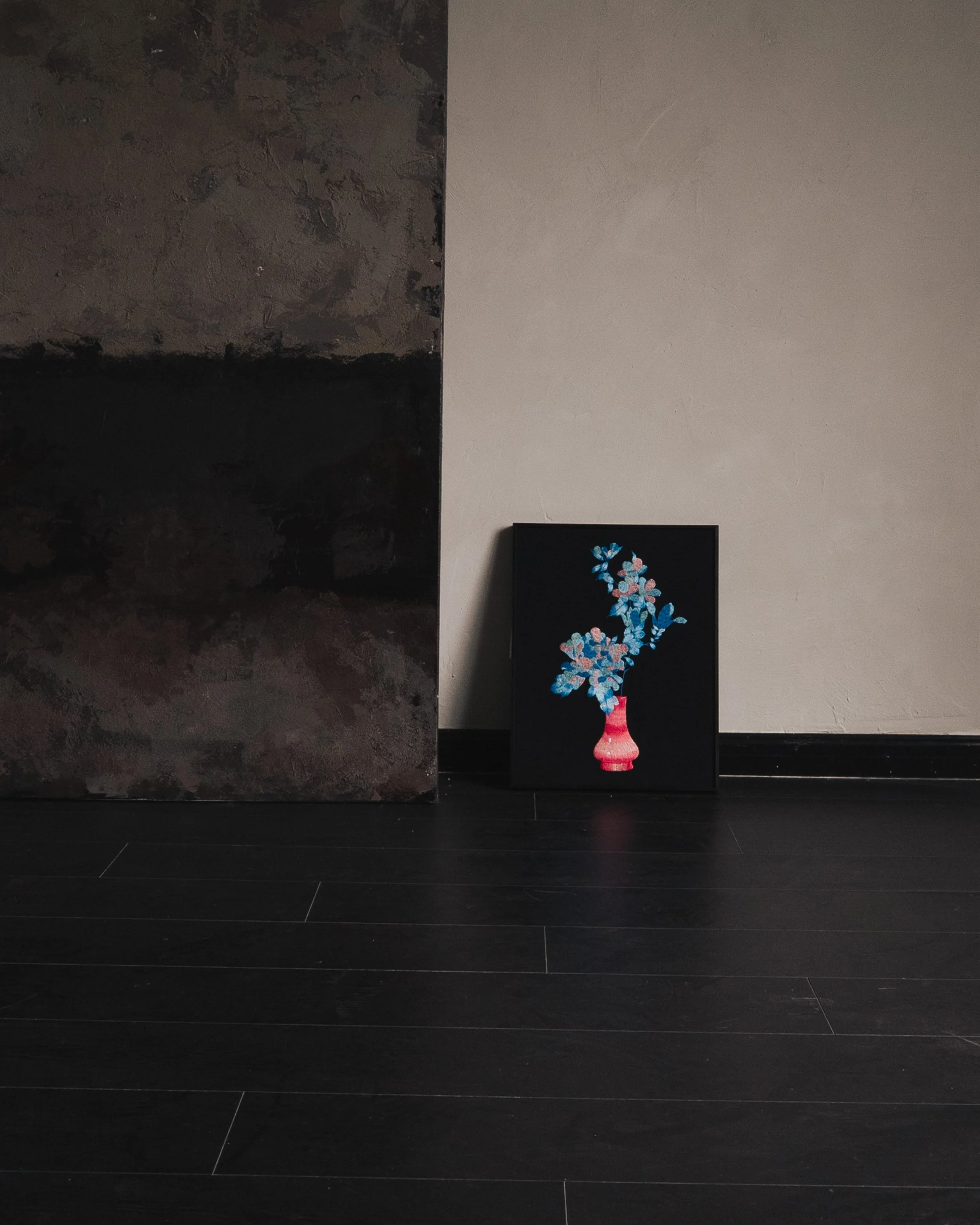 Framed embroidery artwork from teh Etehrelle series leaning against a wall in a minimalist home setting.jpg