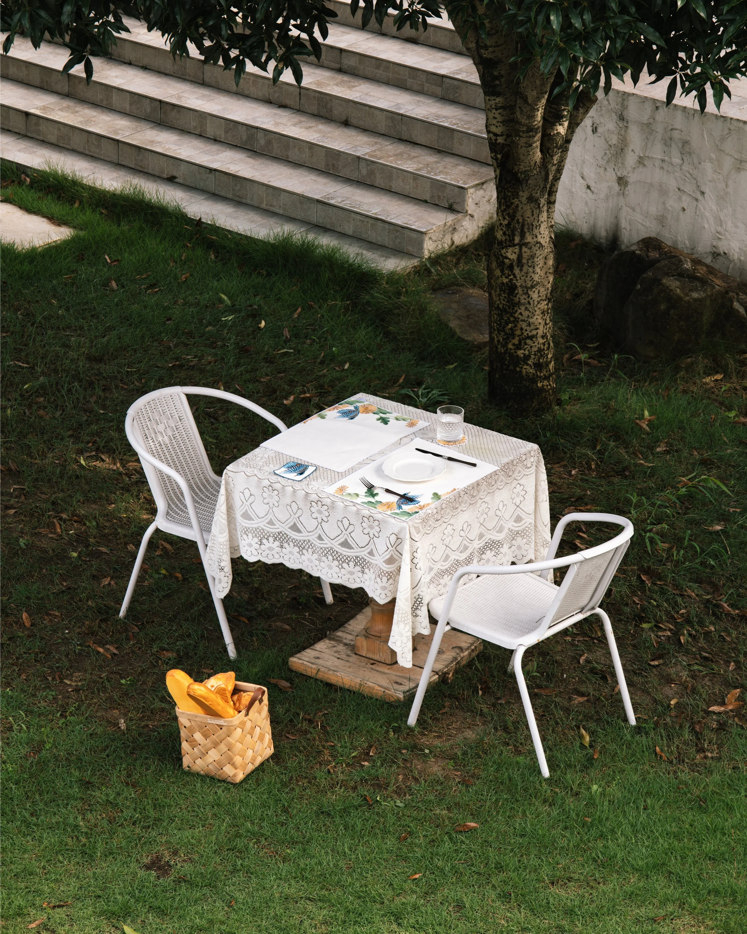 Ramie cotton placemats with botanical embroidery on a garden table.jpg