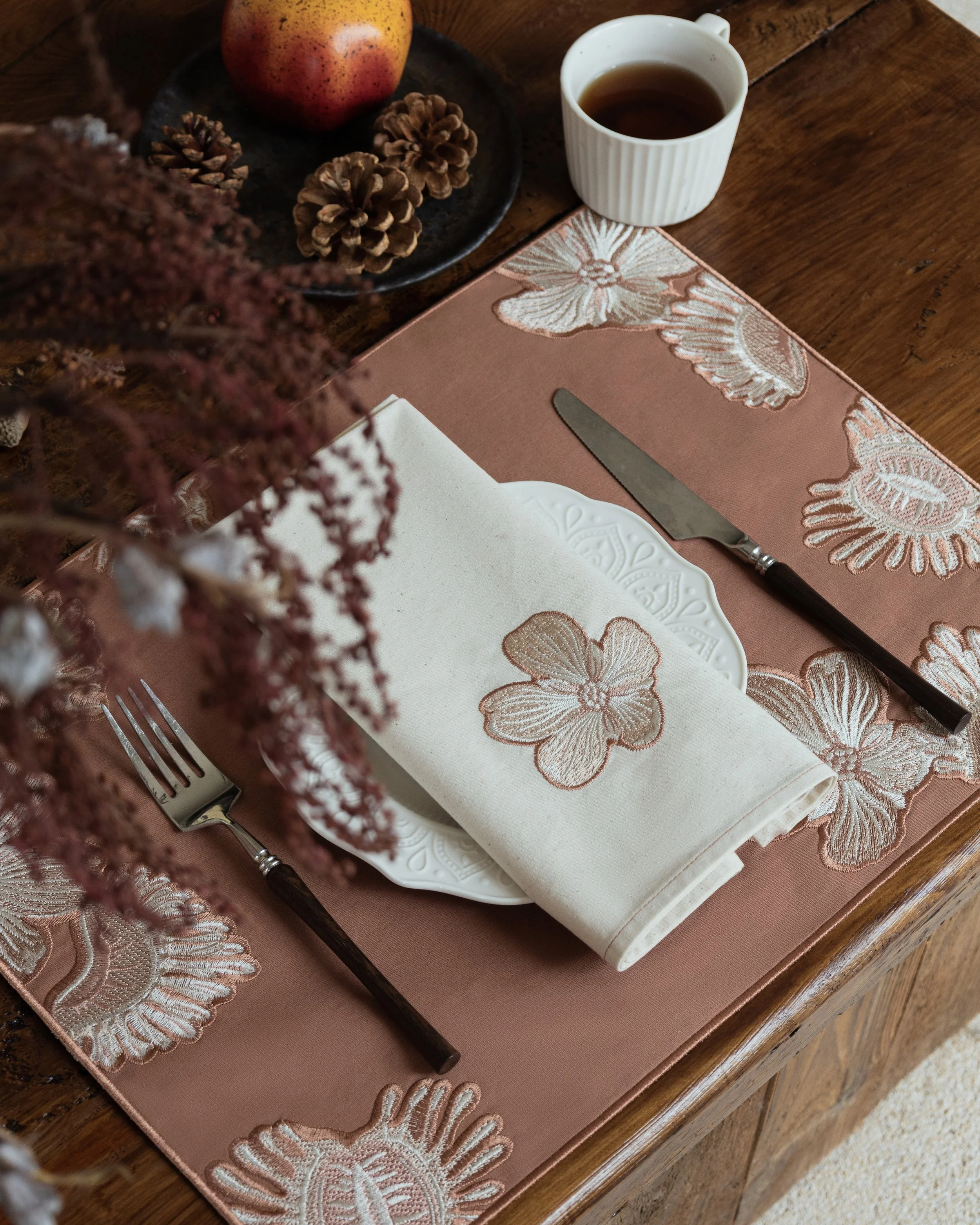 Dionaea Embroidered placemat and napkin in table setting.jpg