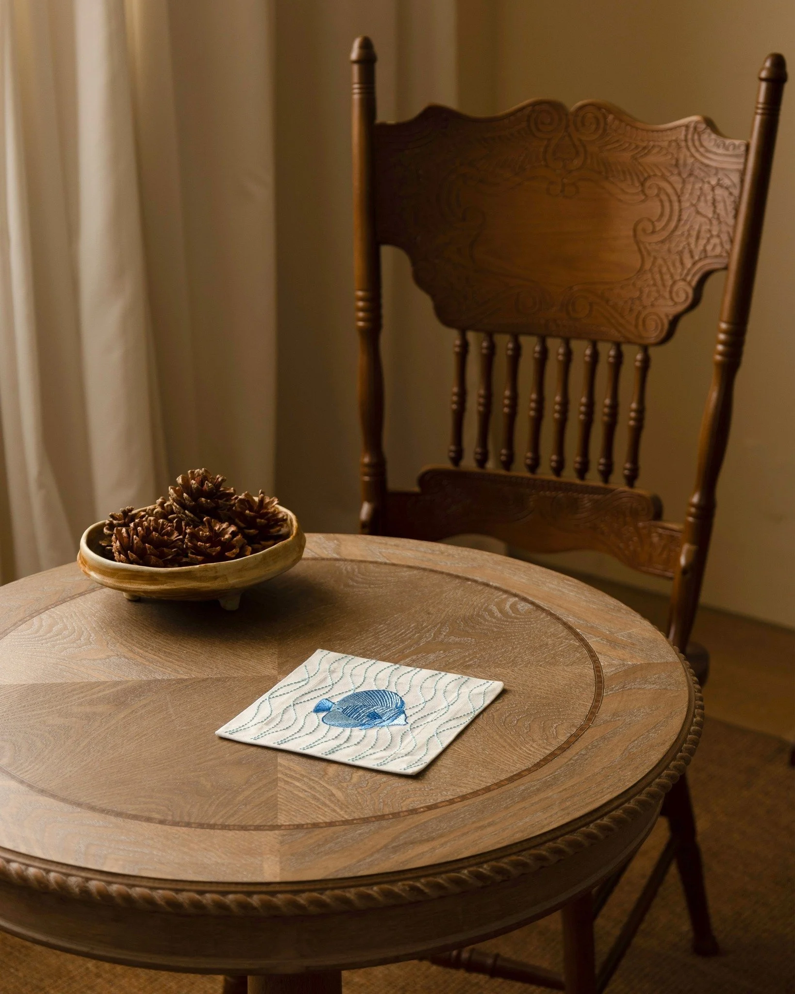 The embroidered cocktail napkin from the Aqua series brings a quiet sense of movement, as if something were slowly swimming through the light.

#cocktailnapkins #coasters #coffeetabledecor #tableaccents #pampan