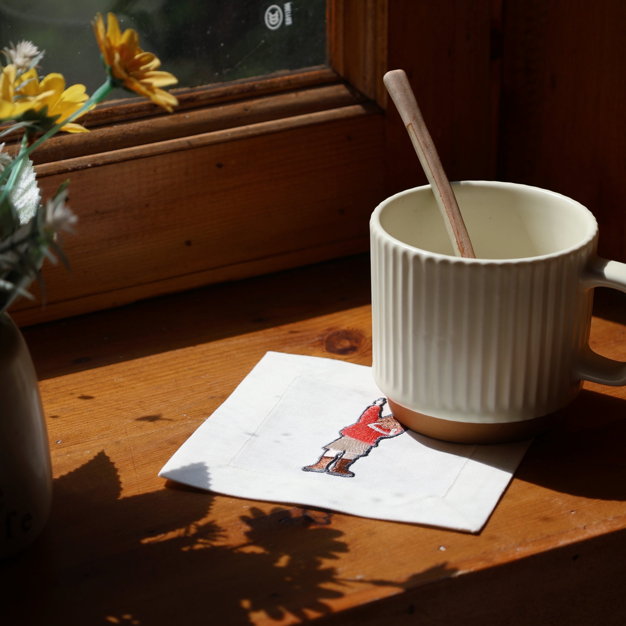 Childhood Memory Cocktail Napkin on Wooden Windowsill Under Sunlight