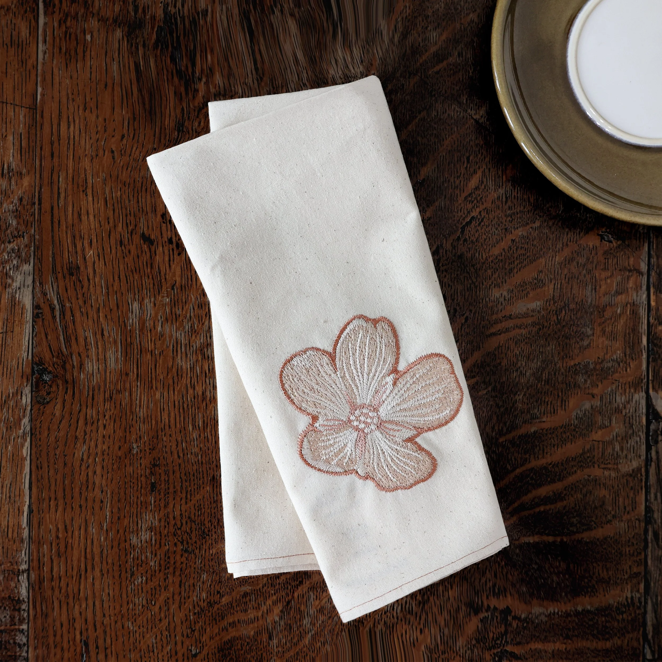 1/8 Fold of Dionaea Embroidered Cotton Napkin on Dark Brown Wooden Table