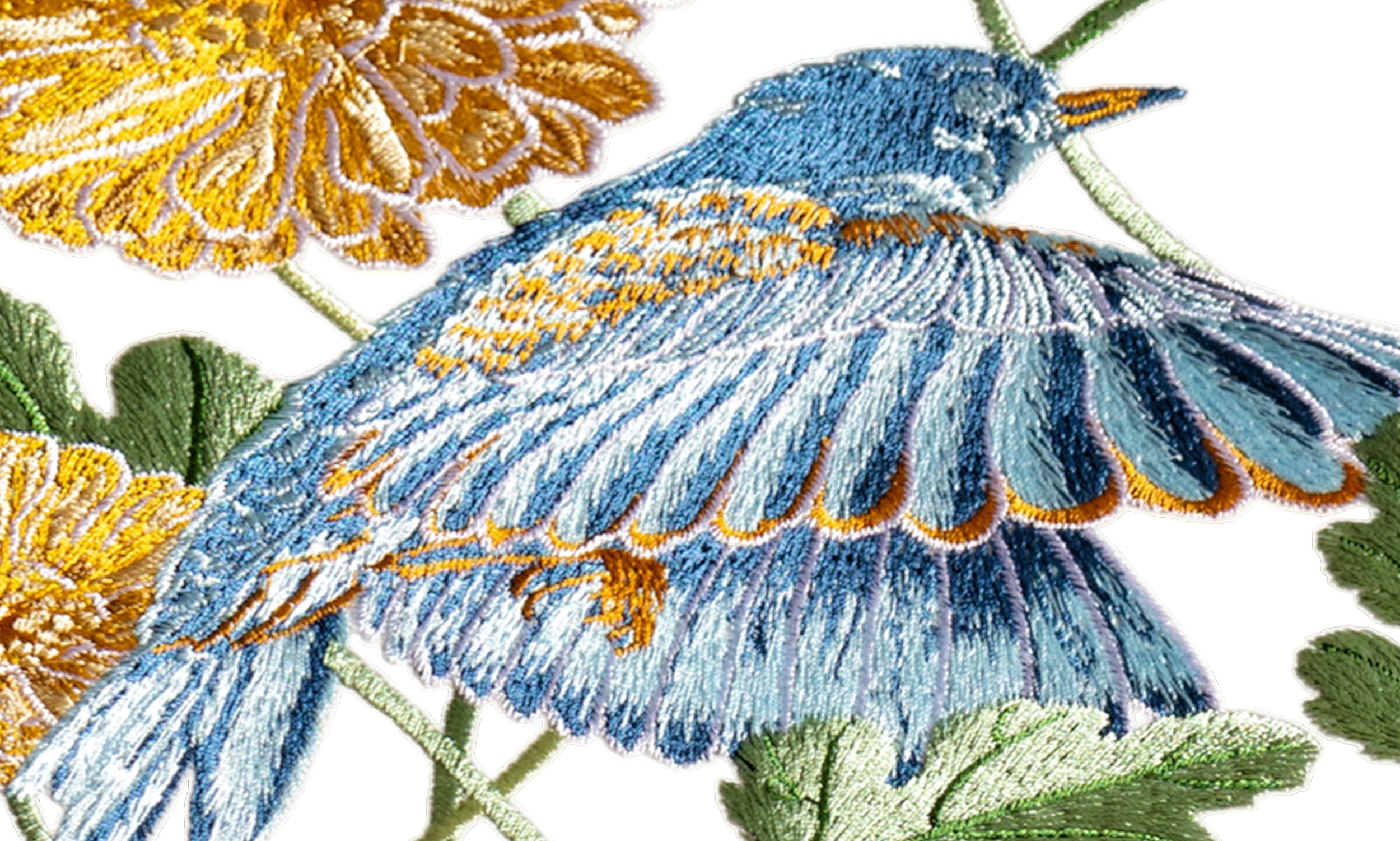 Close-up of bluebird and calendula embroidery from the Garden Series, showing layered blue threadwork on the bird’s wings and golden calendula petals.
