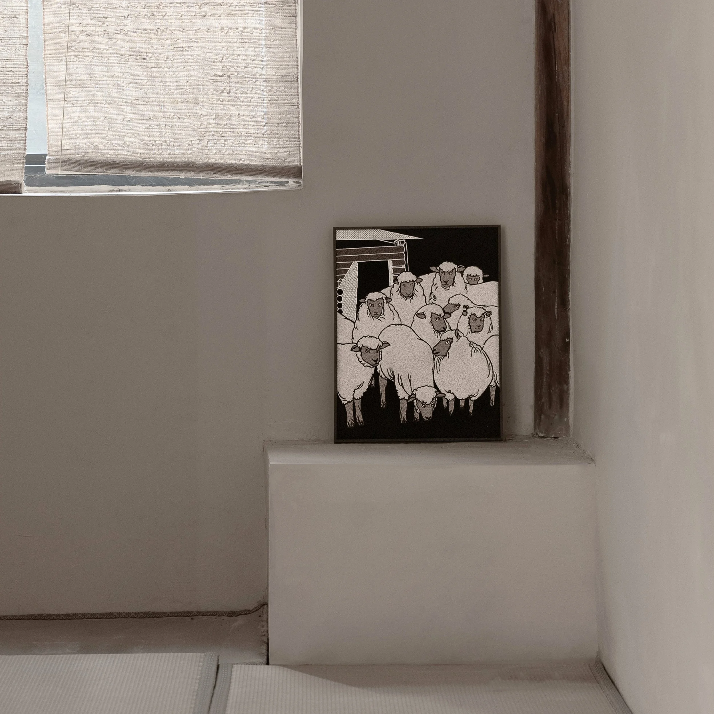 Sheep embroidered wall art styled in a minimalist interior with soft natural light