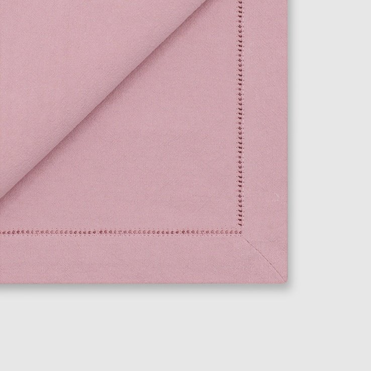 Mitered corner details of the pink hemstitched napkin