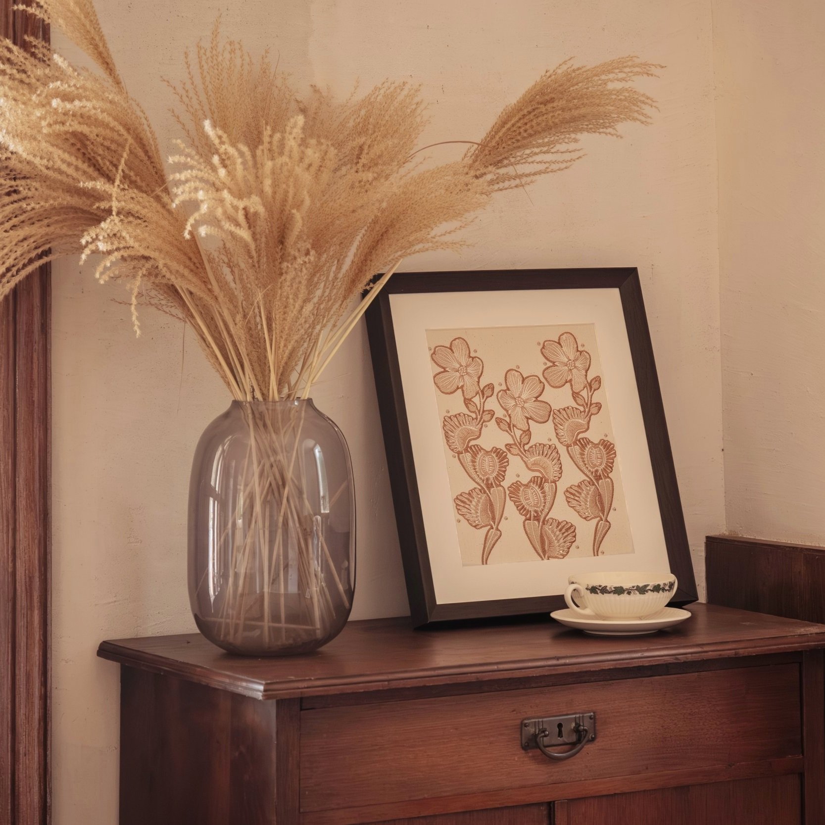 Embroidered modern flytrap flower wall art placed on a wooden cabinet