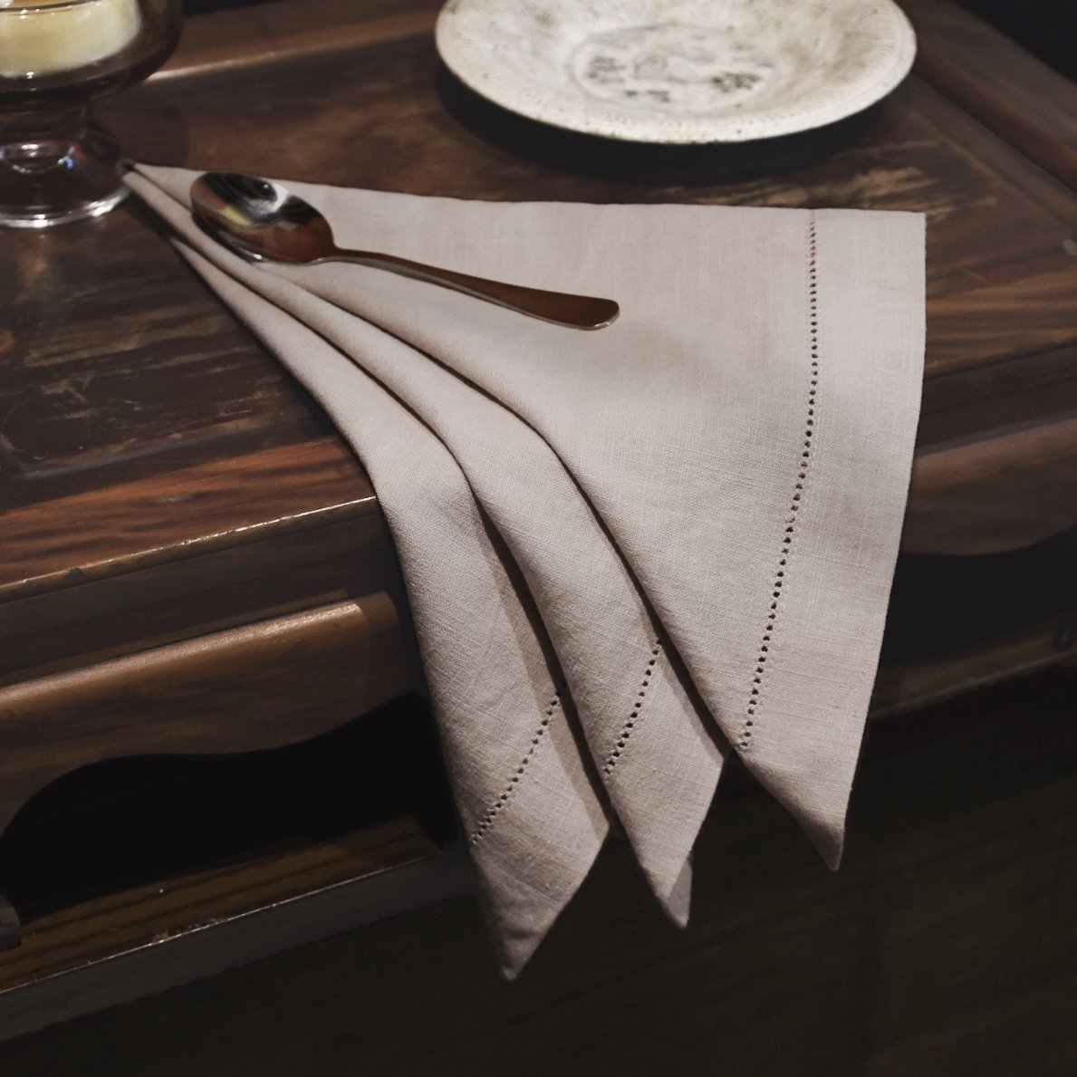 Grey ramie hemstitch embroidered napkin in tri-fold drape