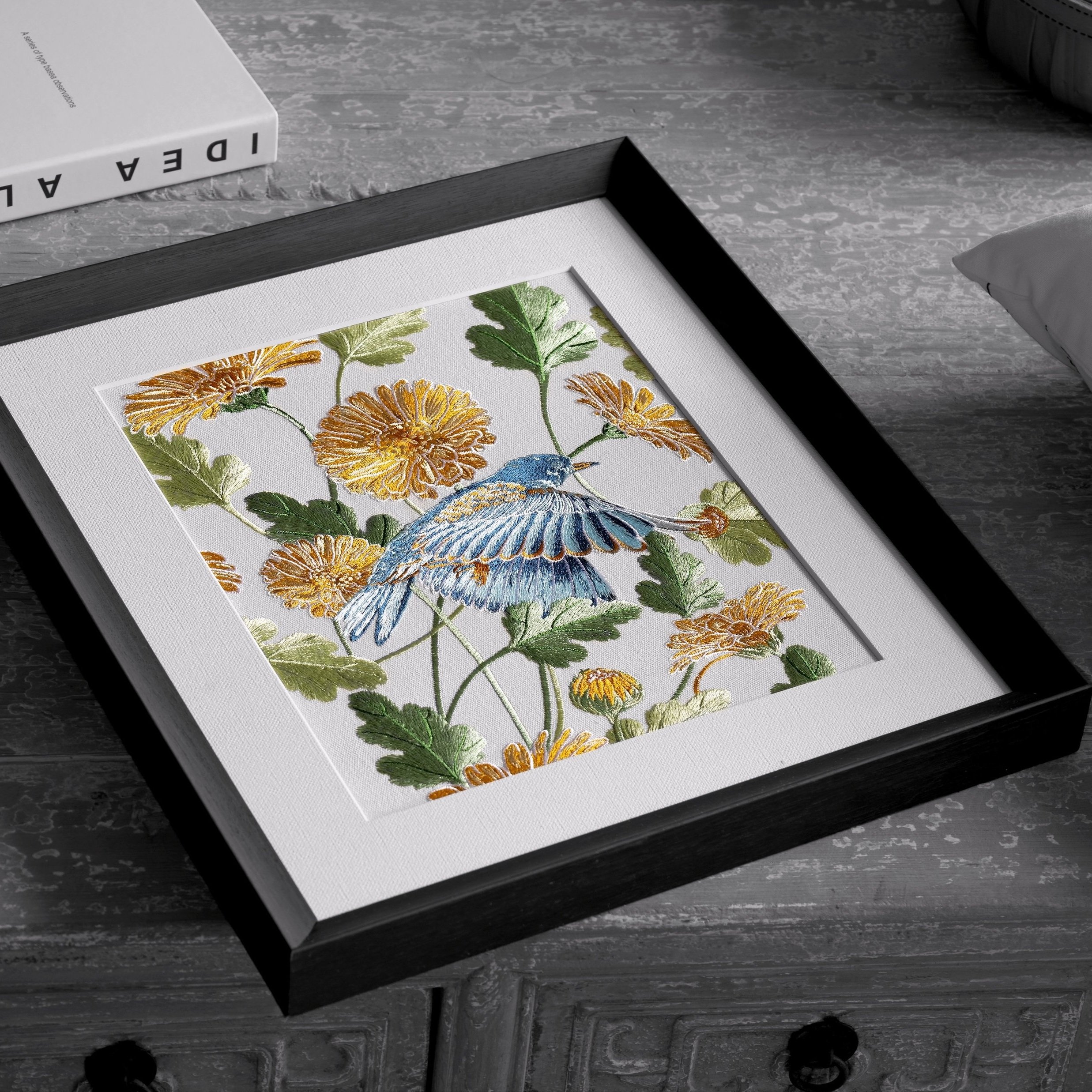 Color Splash Close Shot of Garden Embroidery Wall Art Placed on a Wooden Table