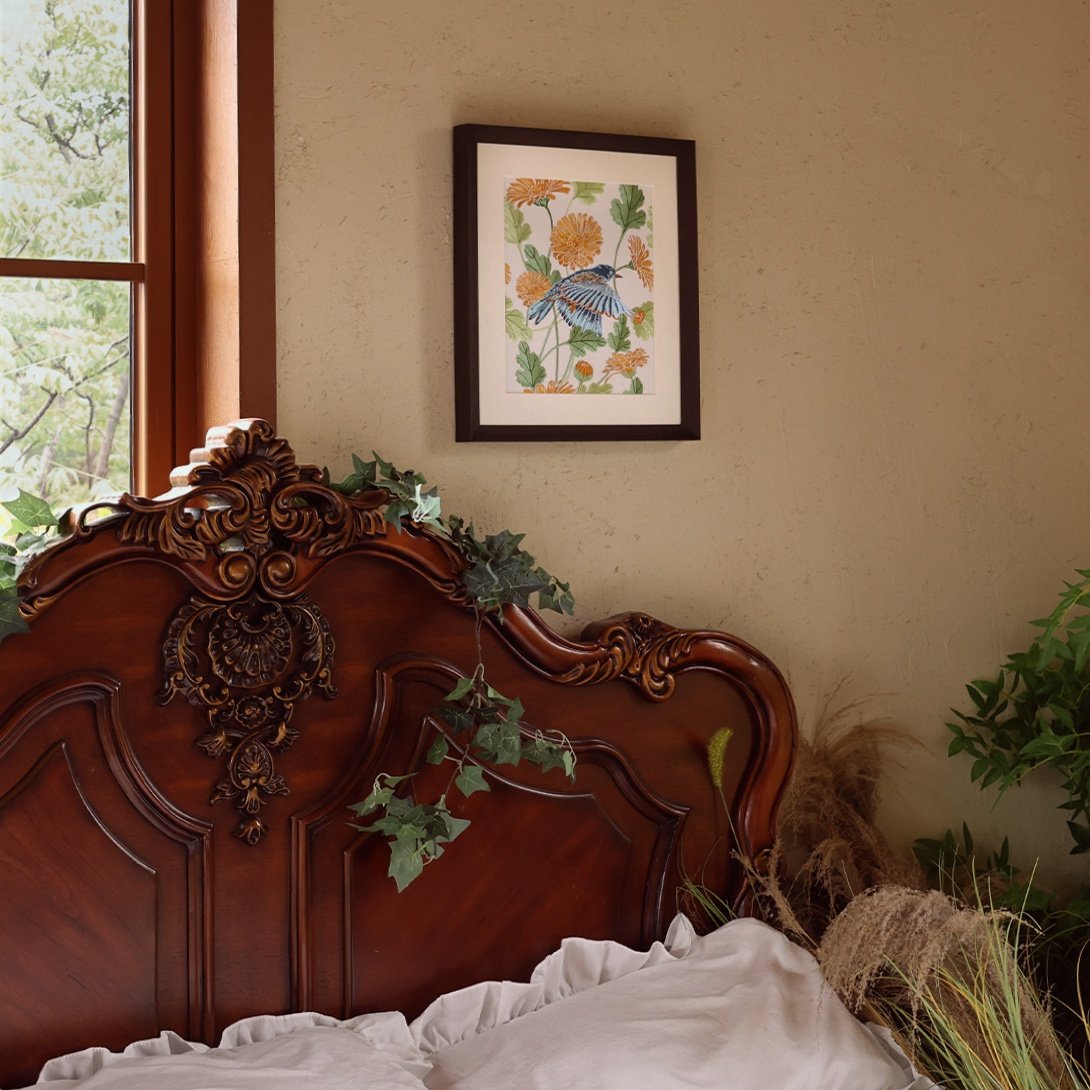 Embroidered Calendula and Bird Wall Art on Bedroom Wall