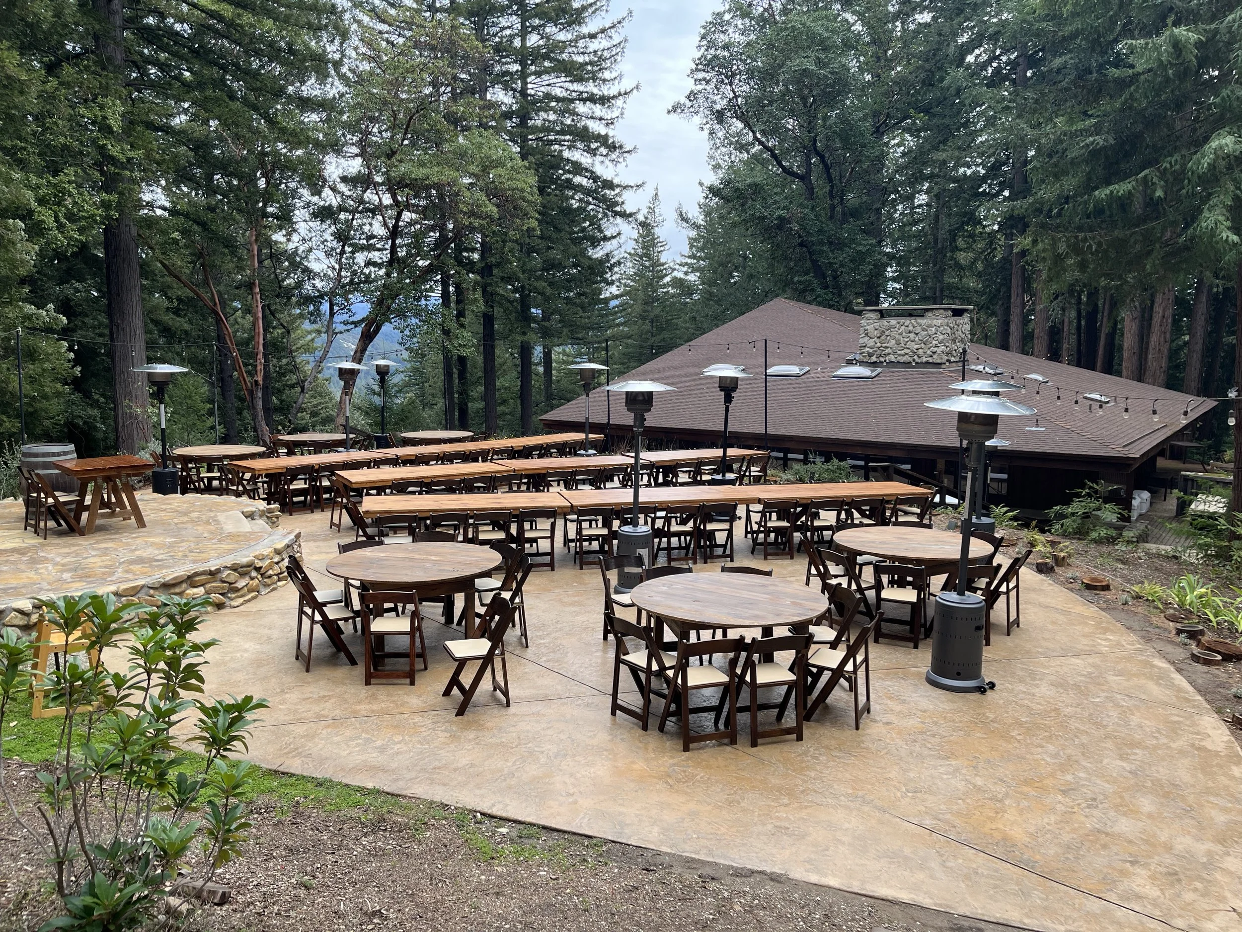 Junebug Events patio heaters set up for an outdoor reception at a redwood venue in the Santa Cruz Mountains