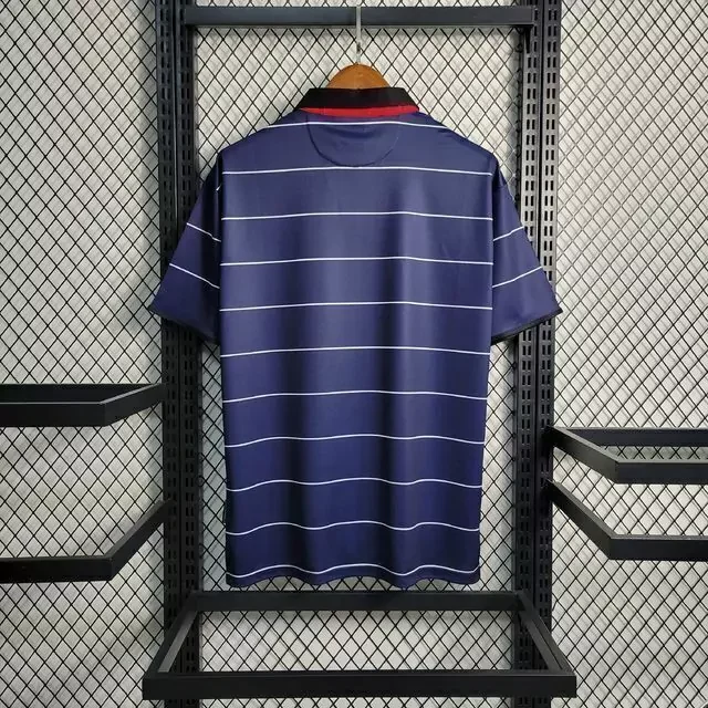camisa-retro-manchester-united-away-1999-umbro-azul-escuro-imagem2-jpeg1-4a20c7743731fafcbf16942151129374-1024-1024.webp