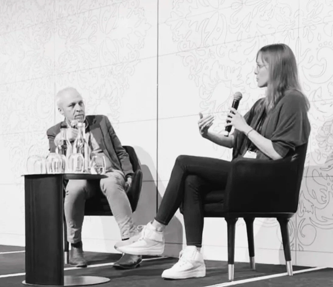 Laura E. Fischer speaking on a panel at a conference