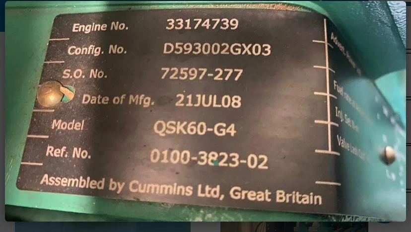 Engine identification plate with details such as engine number, configuration, serial number, manufacturing date, model, and reference number, manufactured by Cummins Ltd, Great Britain.