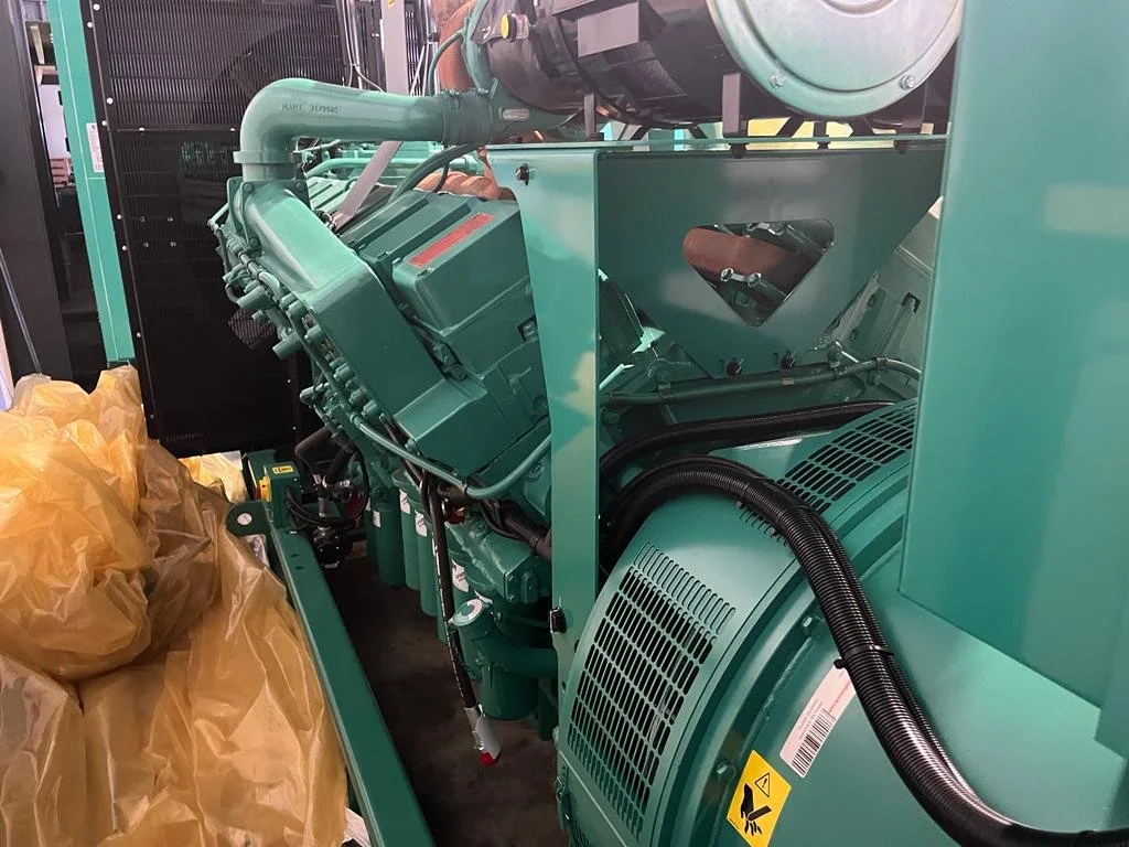 Large industrial green generator in a workshop setting
