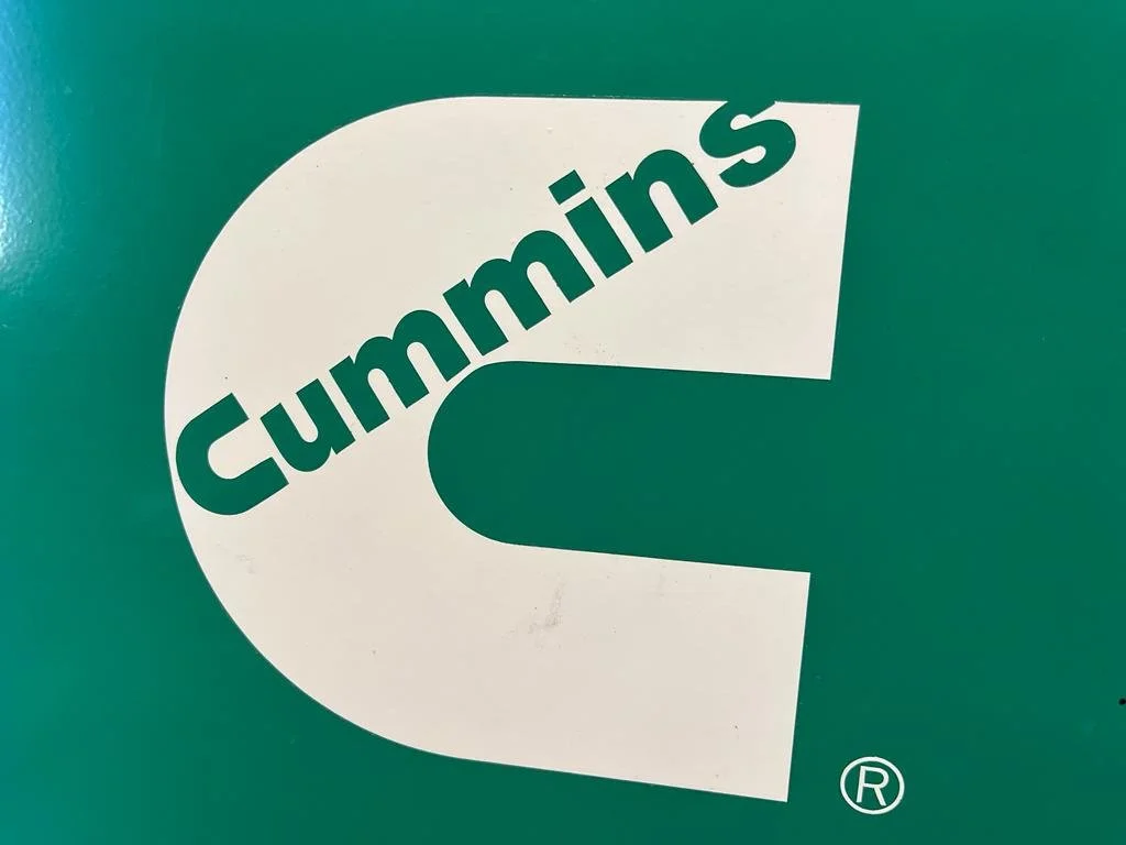 Cummins logo with a white "C" and the word "Cummins" on a green background.