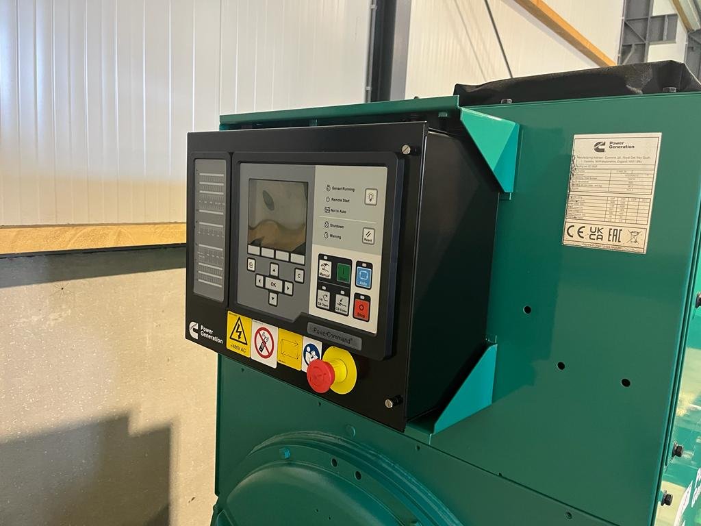 Control panel of a Cummins power generation generator in a warehouse.