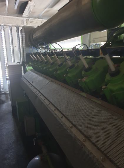 Industrial engine inside a large facility